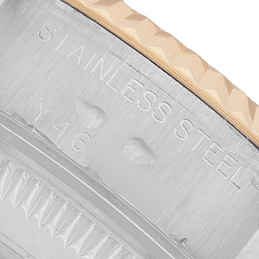The image shows a close-up of the side of a Rolex Datejust 79173 Women's Steel and Gold (two tone) White Dial watch, focusing on the stainless steel casing and part of the bezel.