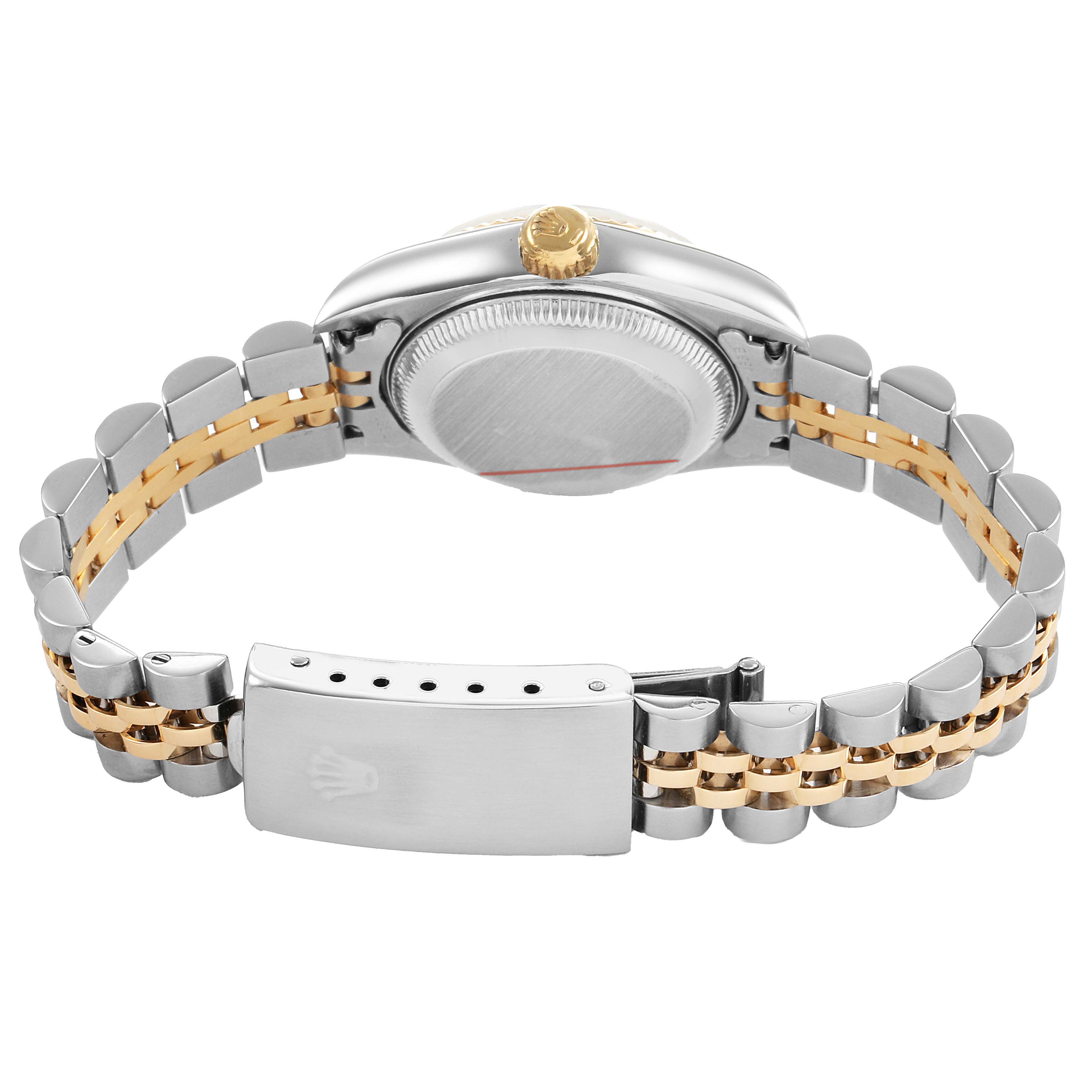 The image shows the back and clasp of a Rolex Datejust 79173 Women's Steel and Gold (two tone) White Dial, highlighting its two-tone bracelet and case back from a side angle.