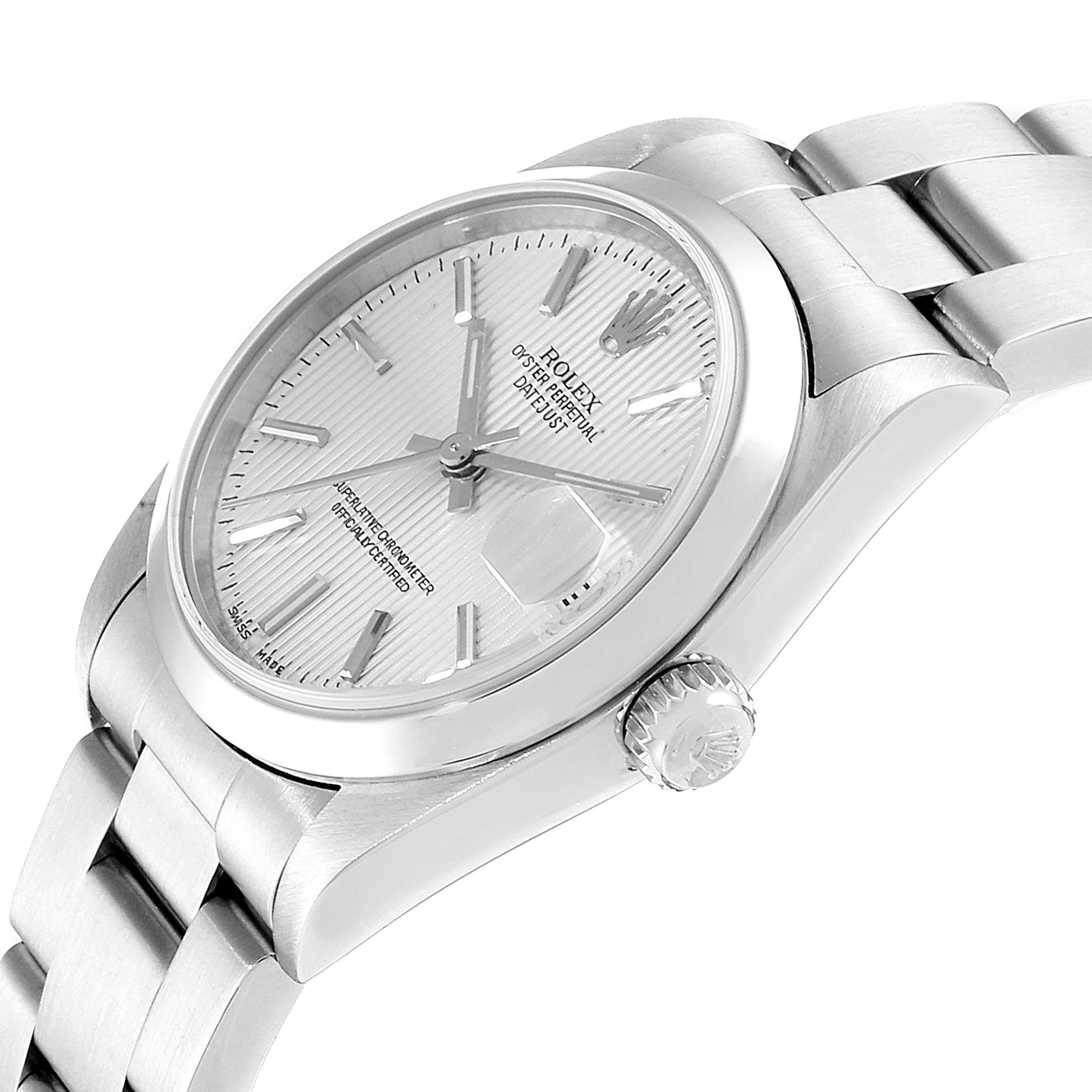 This image shows a side angle of a Rolex Mid-Size 78240 Women
s Stainless Steel Silver Dial 78240 Women
s Stainless Steel Silver Dial watch, highlighting the crown, band, and detailed face.