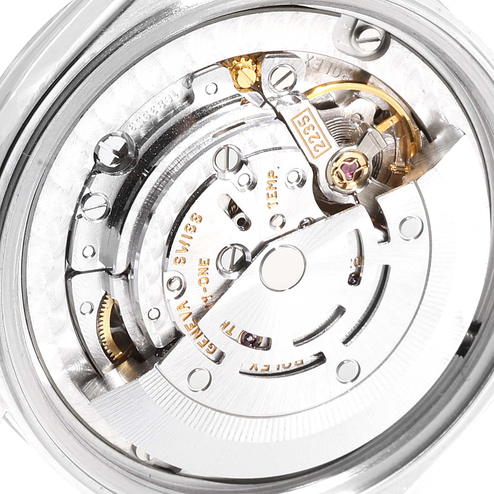 The image shows the internal mechanism of a Rolex Mid-Size 78240 Women
s Stainless Steel Silver Dial 78240 Women
s Stainless Steel Silver Dial model watch from a rear angle, highlighting the movement components.