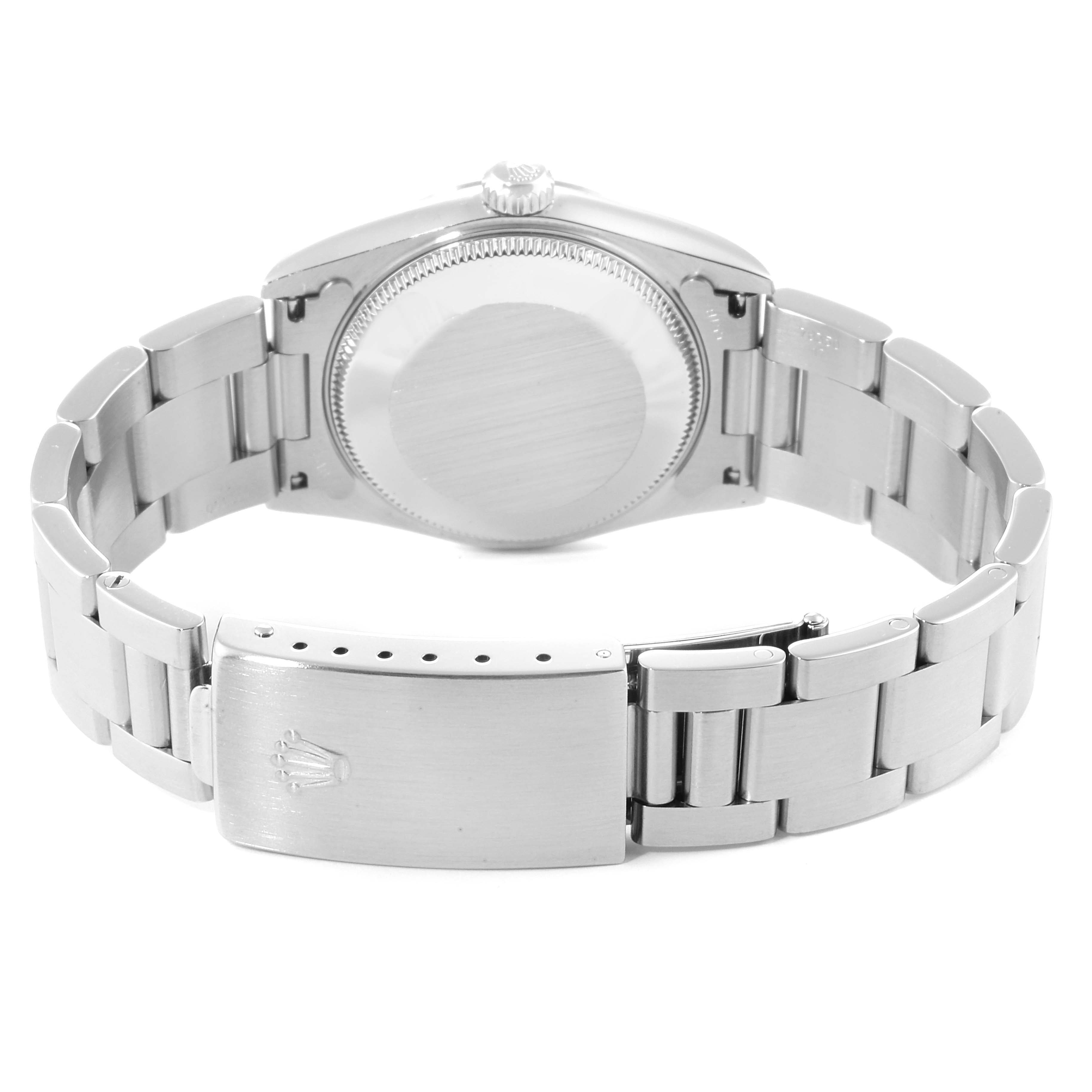 The image shows a rear view of a Rolex Mid-Size 78240 Women
s Stainless Steel Silver Dial 78240 Women
s Stainless Steel Silver Dial watch focusing on the case back and metal bracelet with a clasp.