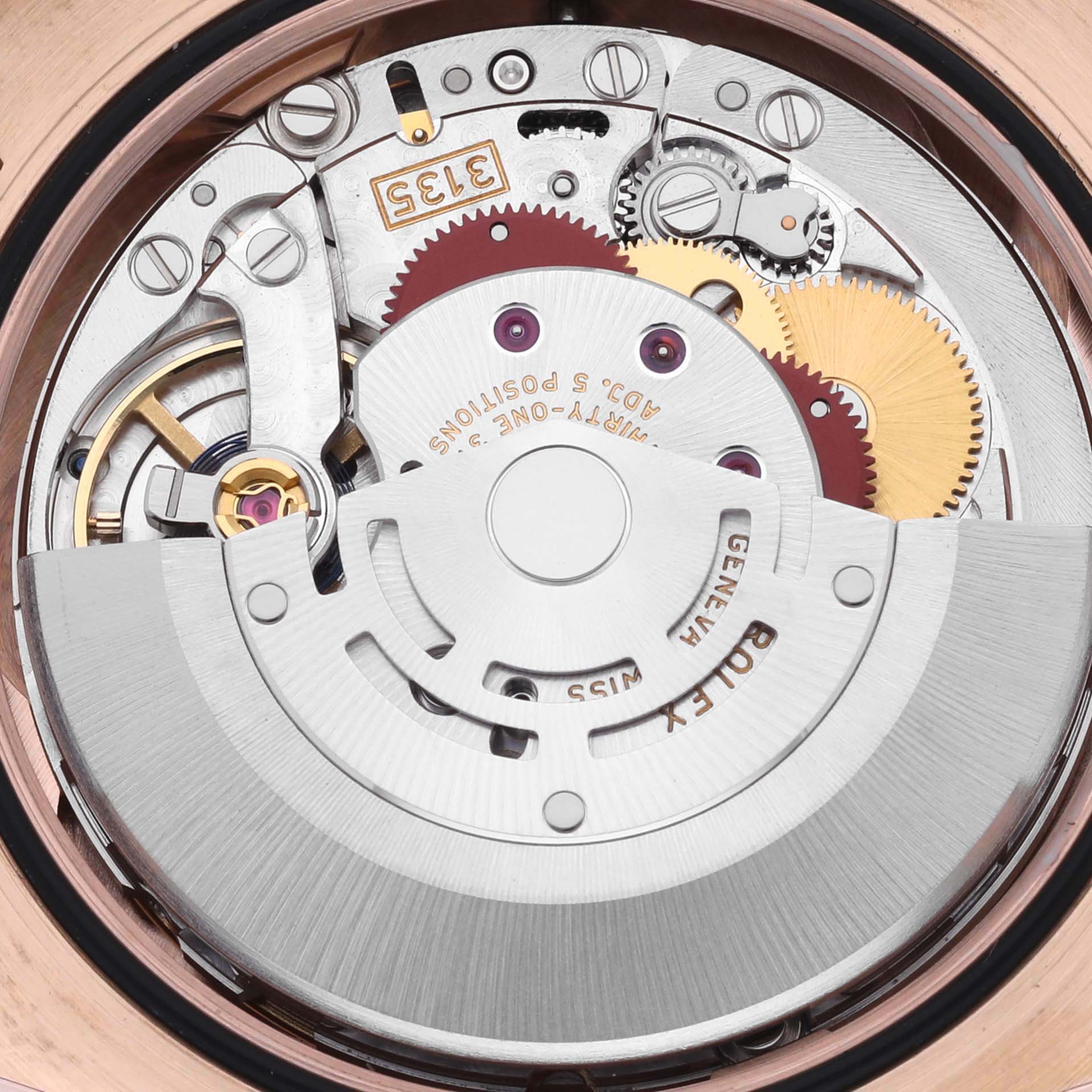 This image shows the movement of a Rolex Datejust 116135 Mens Rose Gold Pink Dial, focusing on the intricate gears and rotor mechanism.