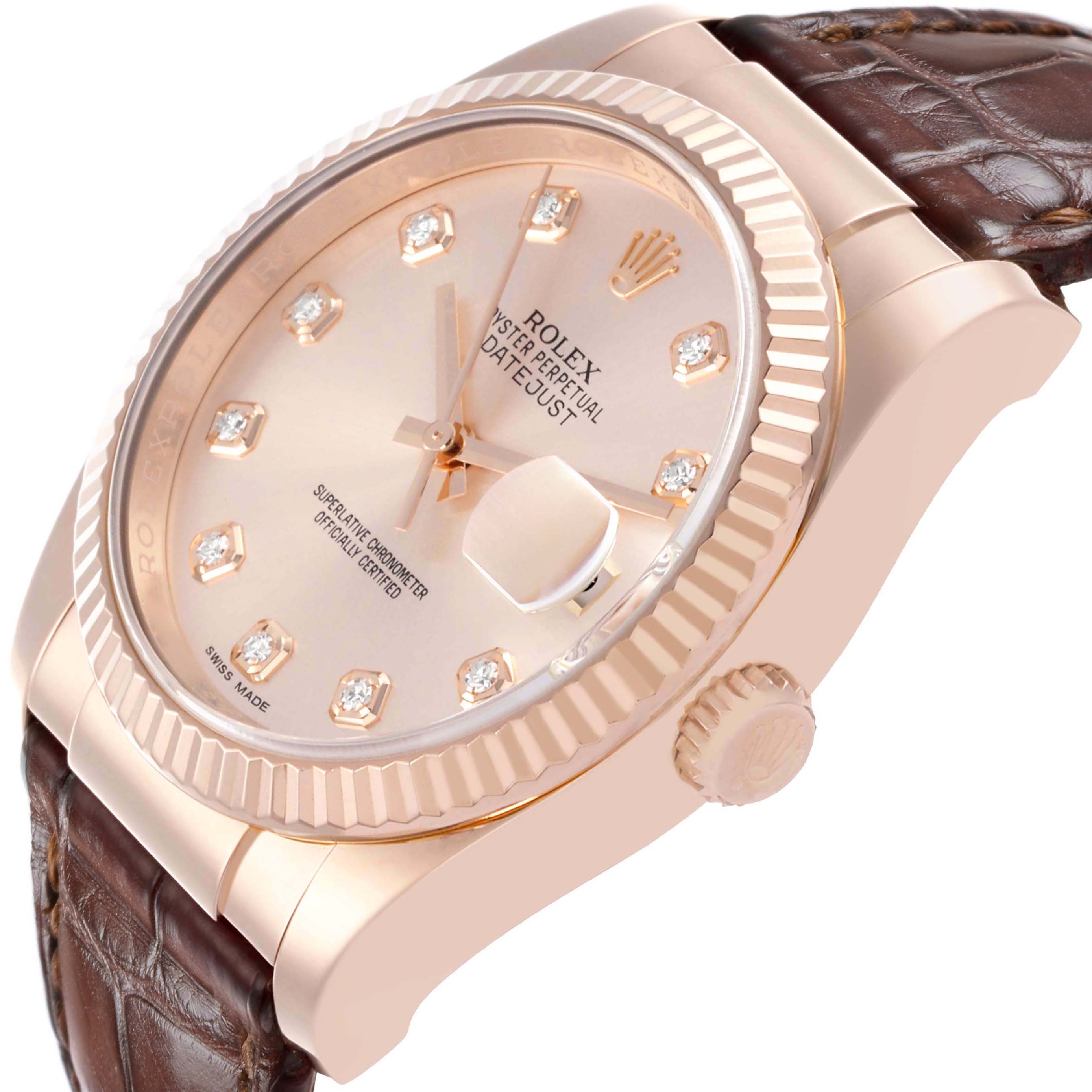 The Rolex Datejust 116135 Mens Rose Gold Pink Dial watch is shown from a side angle, highlighting the face, bezel, crown, and leather strap.
