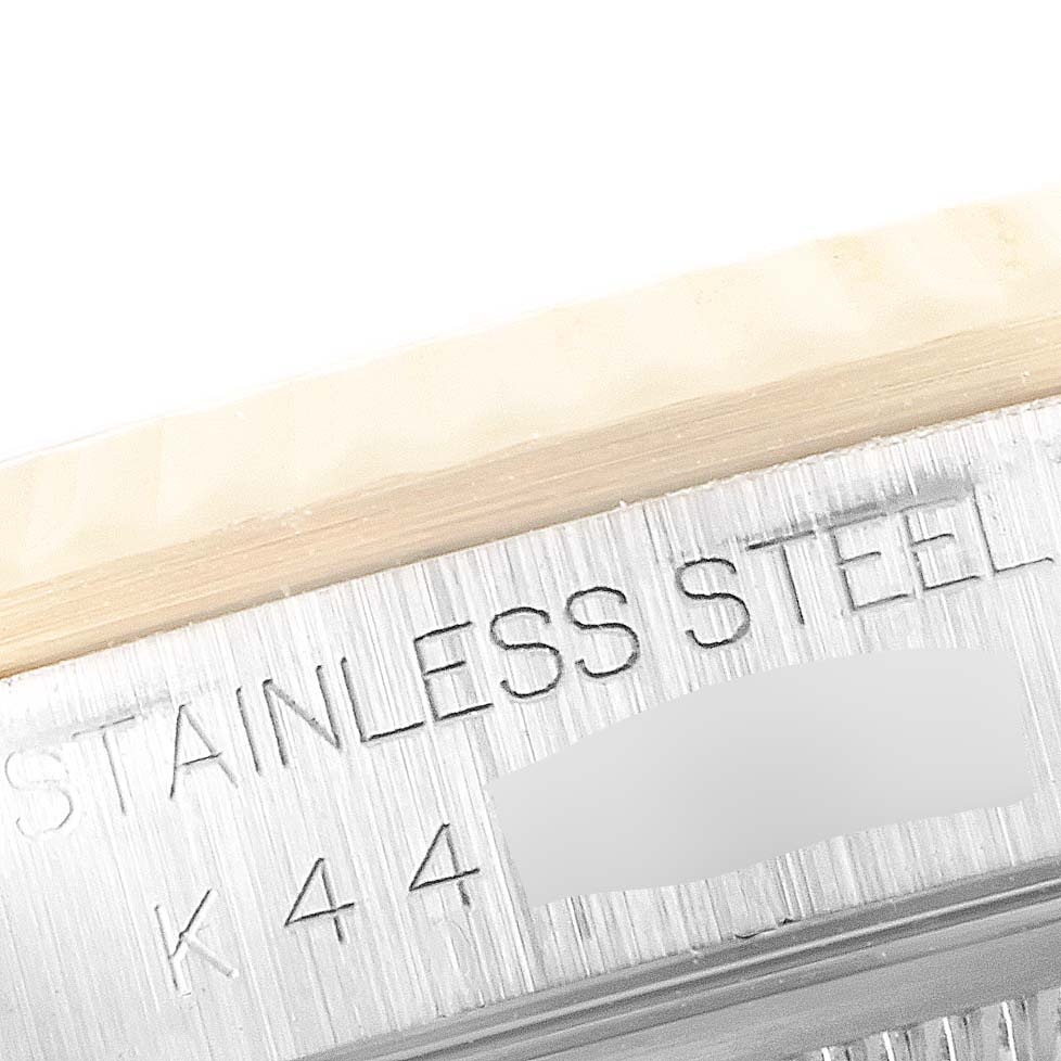 Close-up shot showing the "STAINLESS STEEL" engraving on the casing of the Rolex Datejust 16233 Men's Steel and Gold (two tone) Blue Dial 16233 Men's Steel and Gold (two tone) Blue Dial watch.