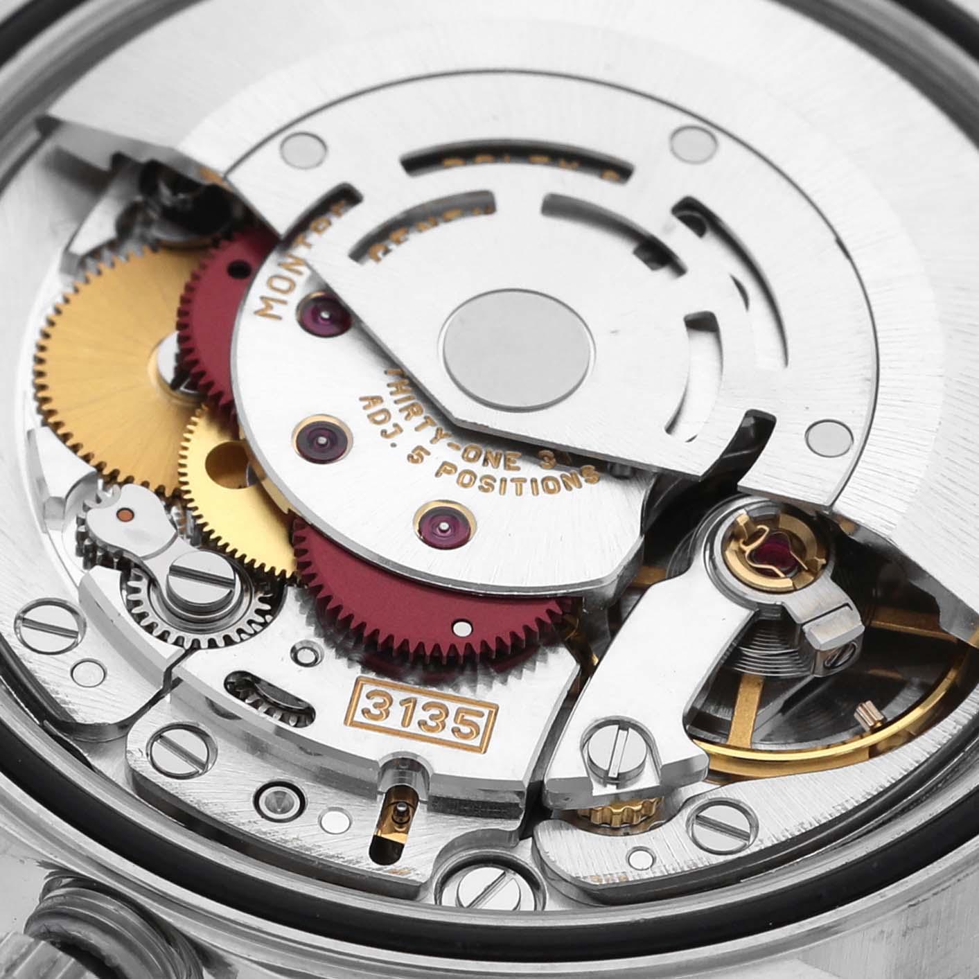 This image shows a close-up of the movement mechanism of a Rolex Datejust 16234 Men's Stainless Steel Silver Dial 16234 Men's Stainless Steel Silver Dial watch, highlighting its gears and intricate parts.
