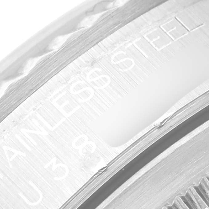 The close-up image shows the engraved text on the inner part of a Rolex Datejust 16234 Men's Stainless Steel Silver Dial 16234 Men's Stainless Steel Silver Dial's stainless steel bezel.