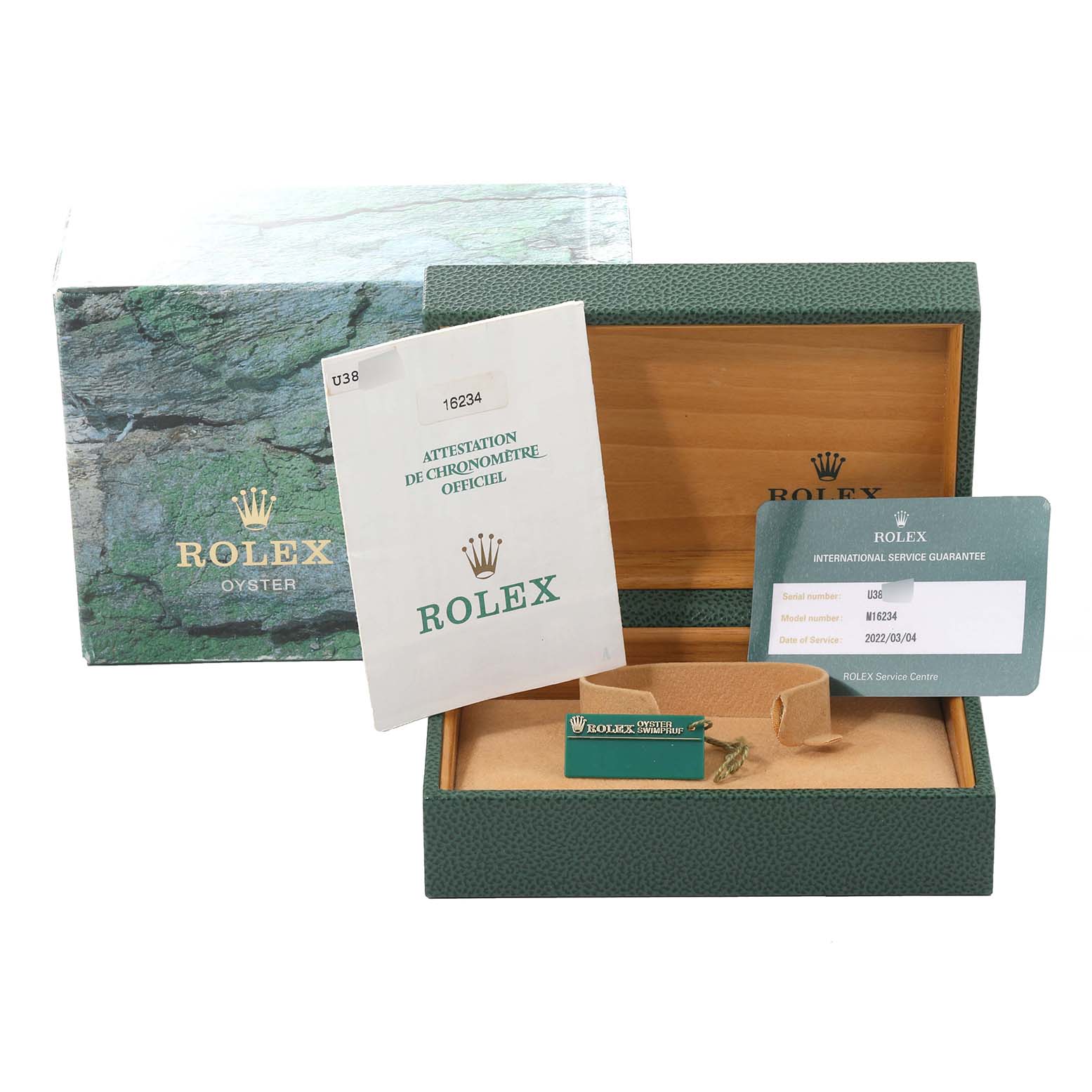 This image shows the open packaging of a Rolex Datejust 16234 Men's Stainless Steel Silver Dial 16234 Men's Stainless Steel Silver Dial, including the box, manual, and warranty card.