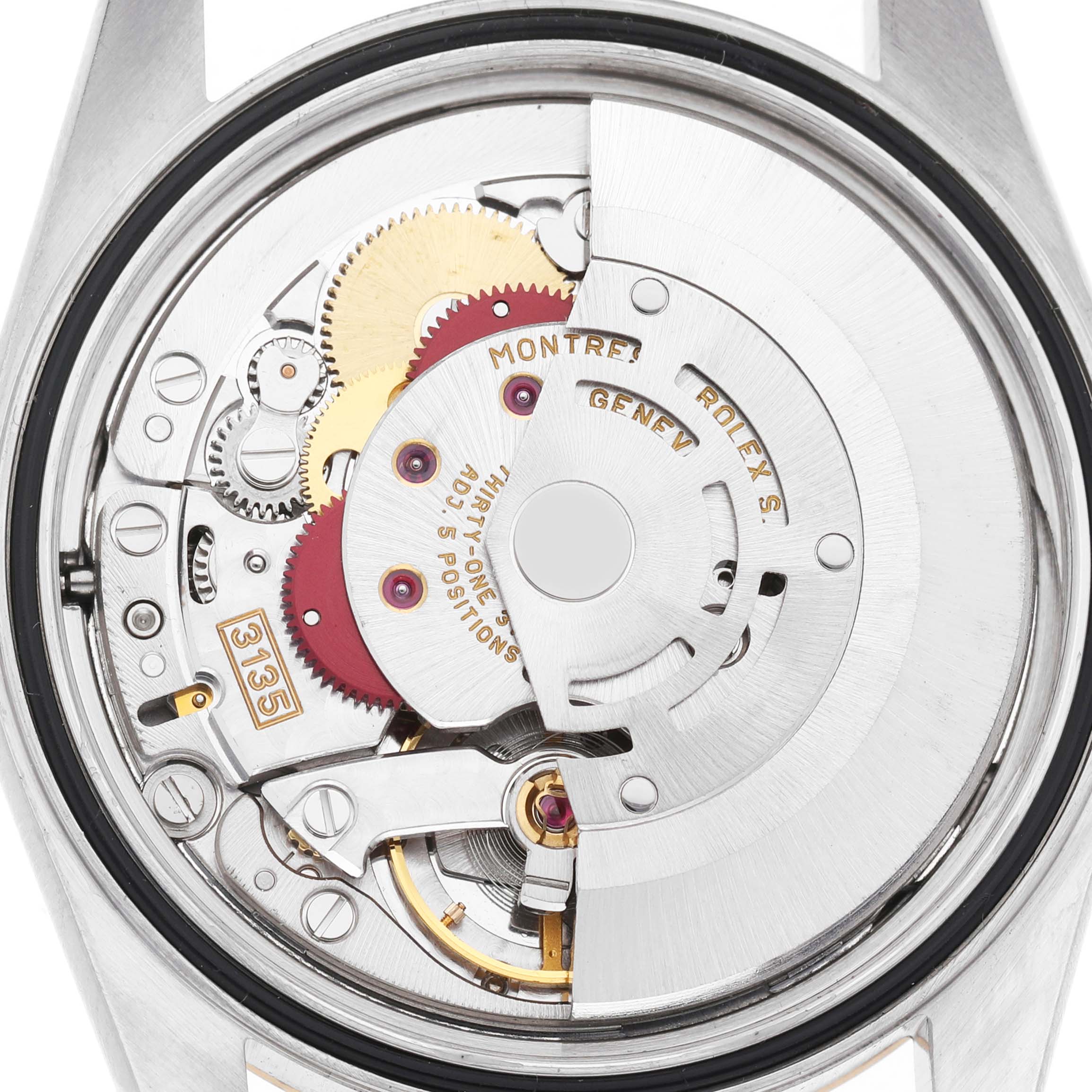 The image shows the open case back of a Rolex Datejust 16233 Men's Steel and Gold (two tone) Champagne Dial, revealing its intricate mechanical movement.