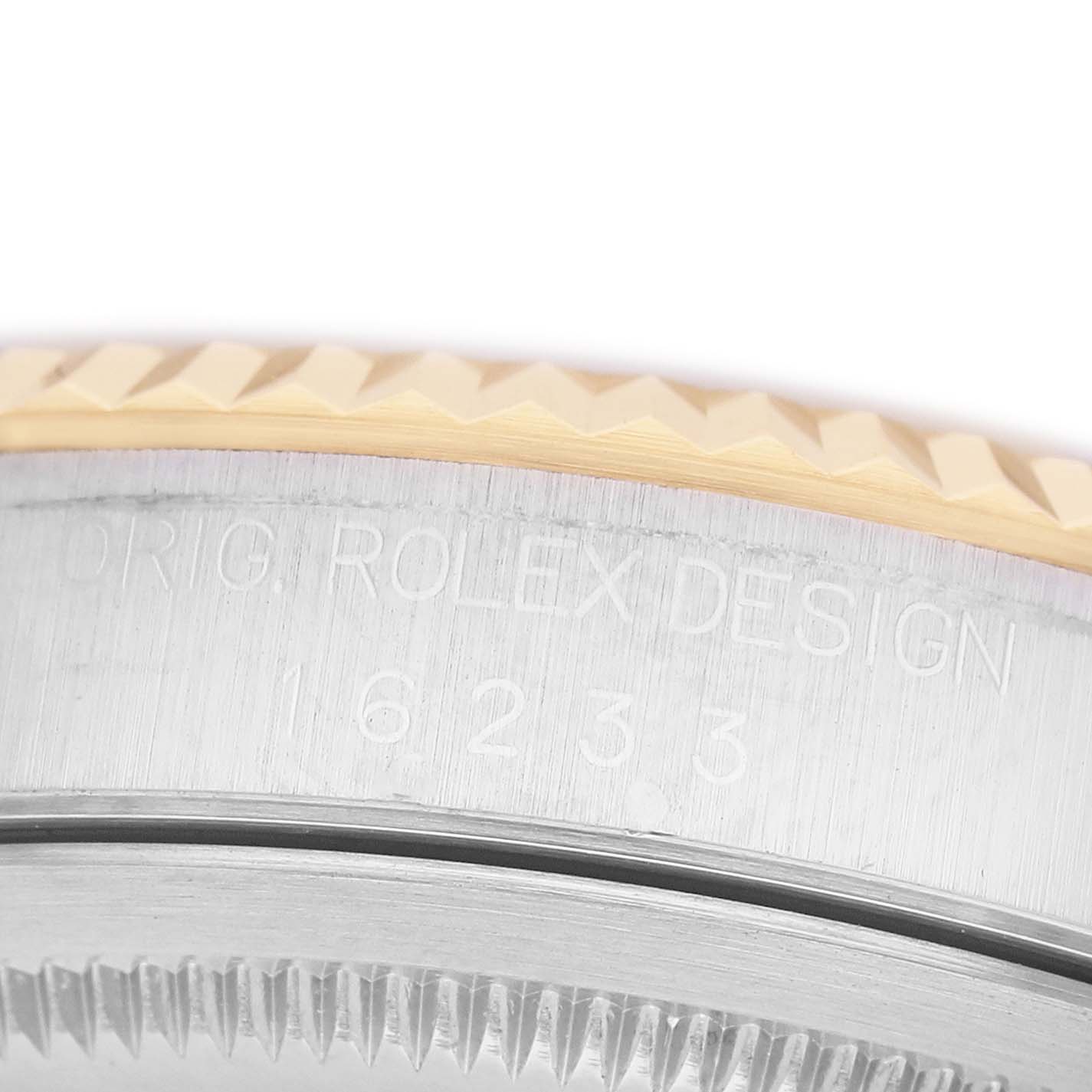 The image shows a partial side view of the Rolex Datejust 16233 Men's Stainless Steel Champagne Dial, highlighting the engraved case side and fluted bezel.
