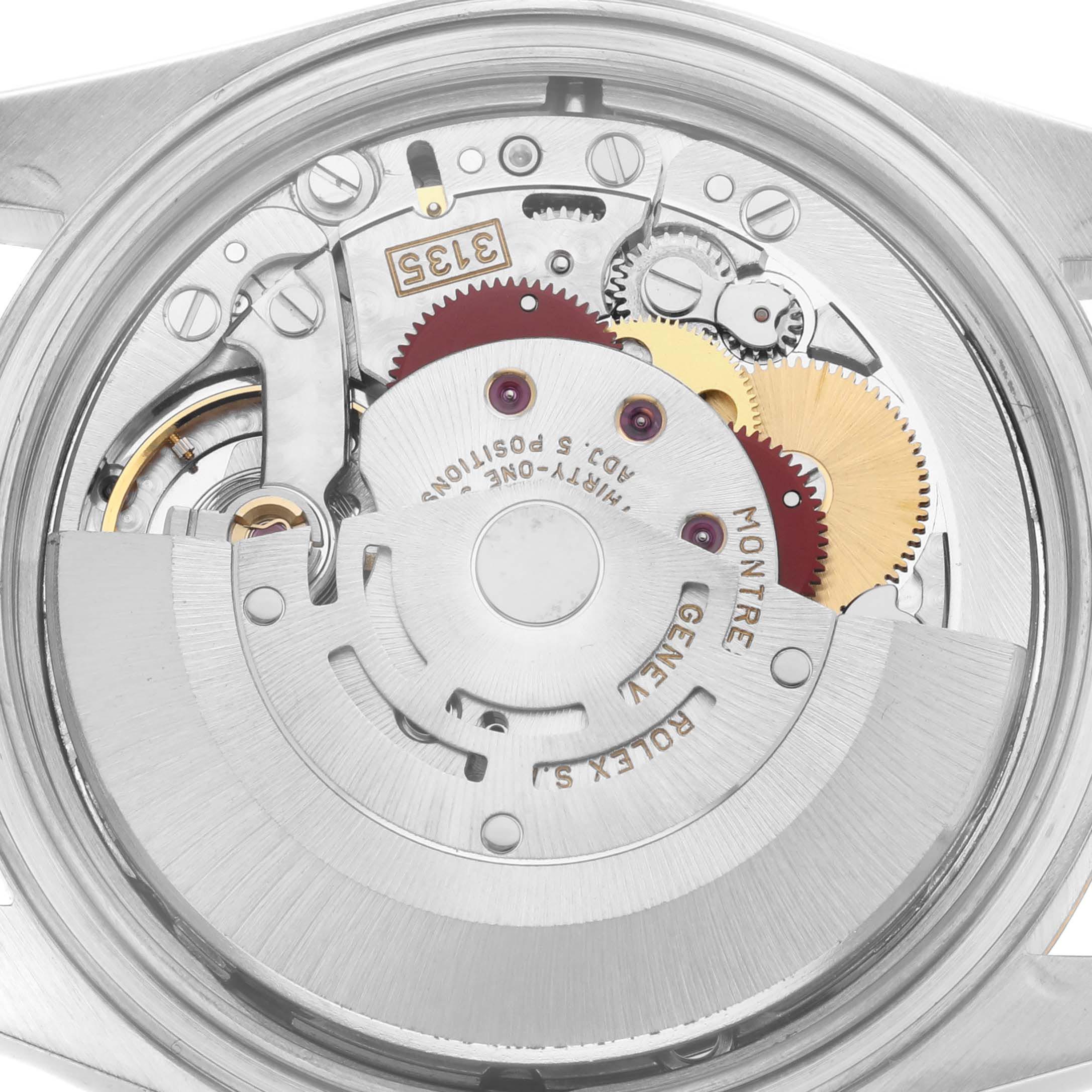 The image shows the internal mechanism of a Rolex Datejust 16233 Men's Steel and Gold (two tone) Champagne Dial 16233 Men's Steel and Gold (two tone) Champagne Dial watch, viewed from the back, highlighting gears and the rotor.