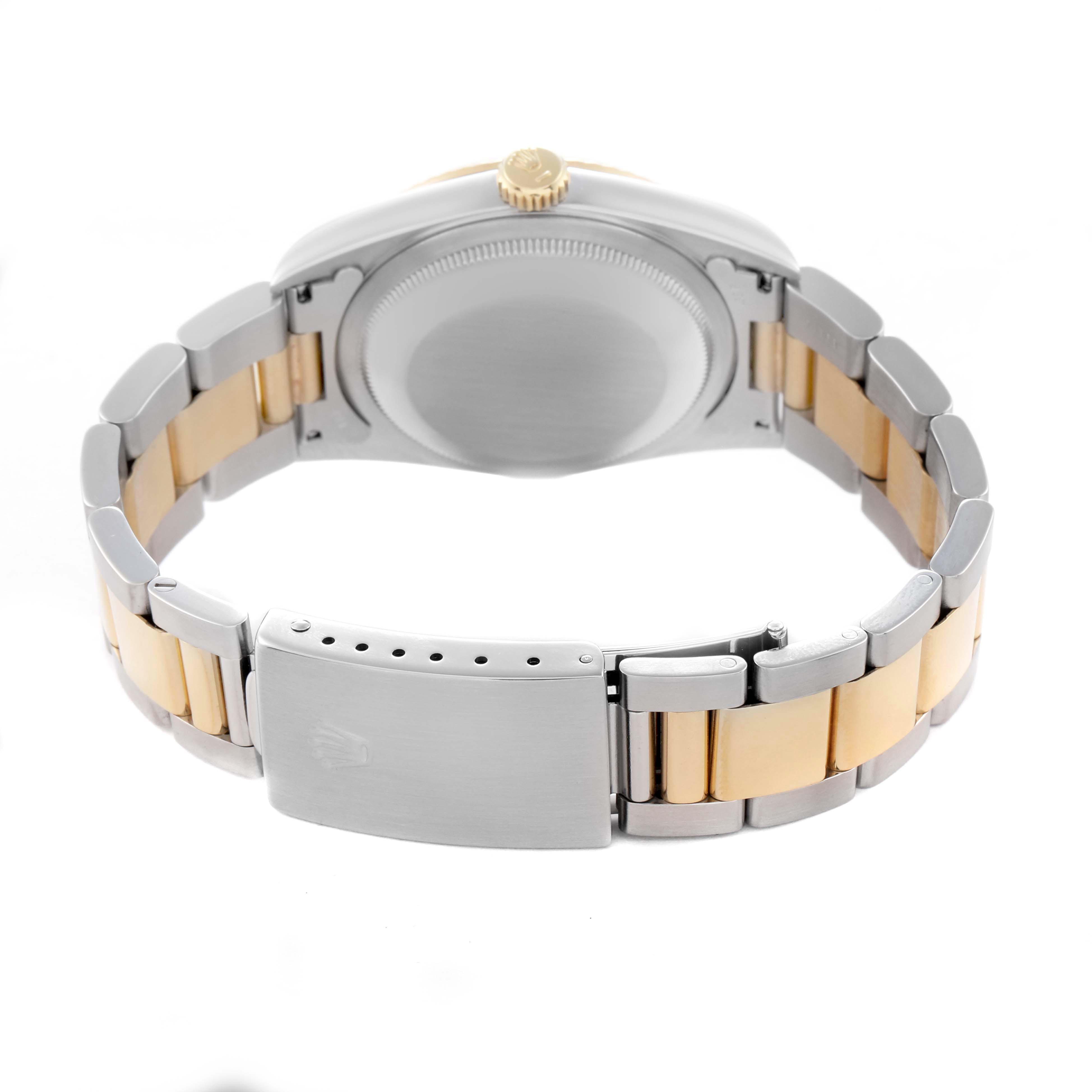 The image shows the case back and bracelet of a Rolex Datejust 16233 Men's Steel and Gold (two tone) Champagne Dial 16233 Men's Steel and Gold (two tone) Champagne Dial, focused on the clasp and gold accents.