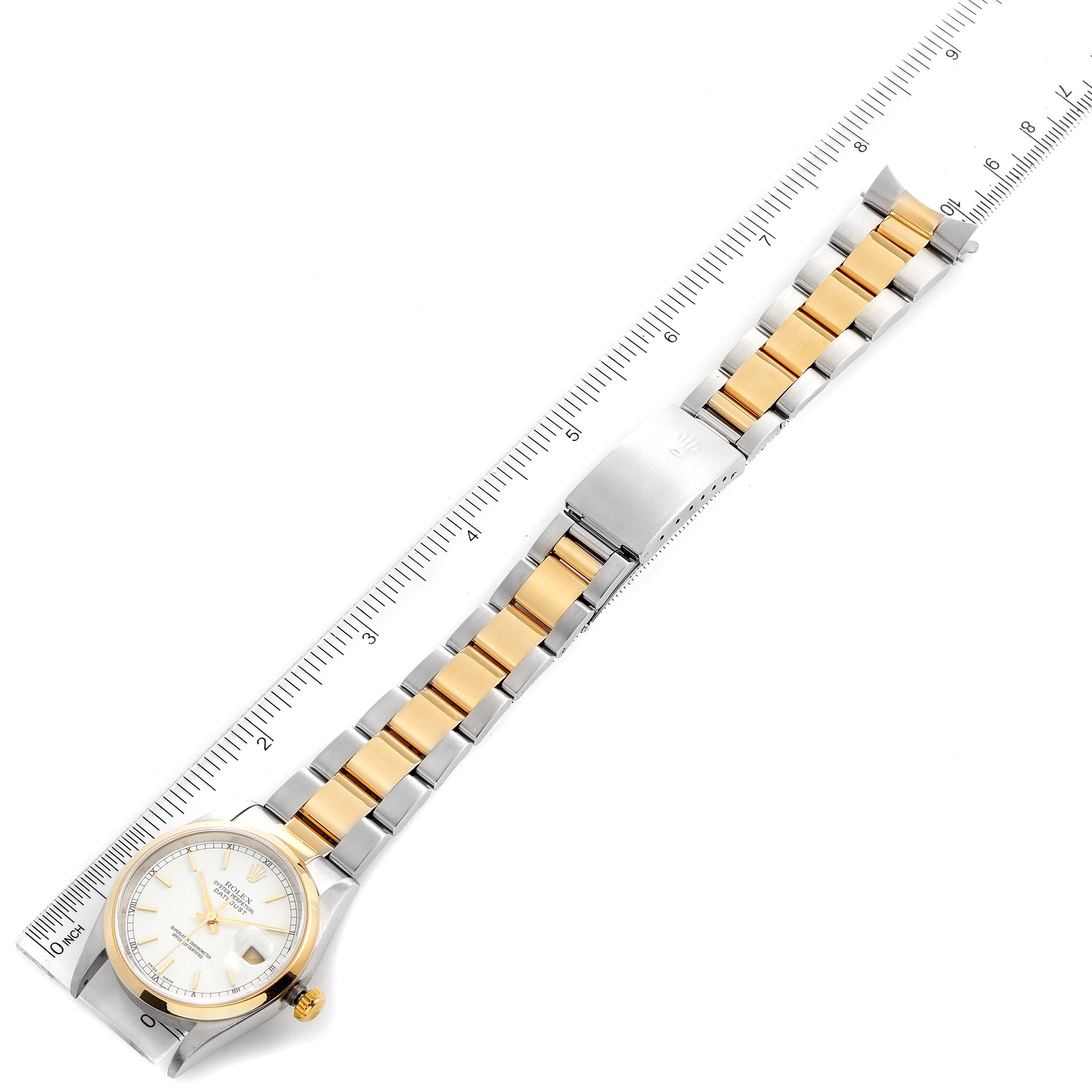 The Rolex Datejust 16203 Men's Steel and Gold (two tone) White Dial 16203 Men's Steel and Gold (two tone) White Dial watch is shown flat with an emphasis on its gold and silver bracelet and the face of the watch.