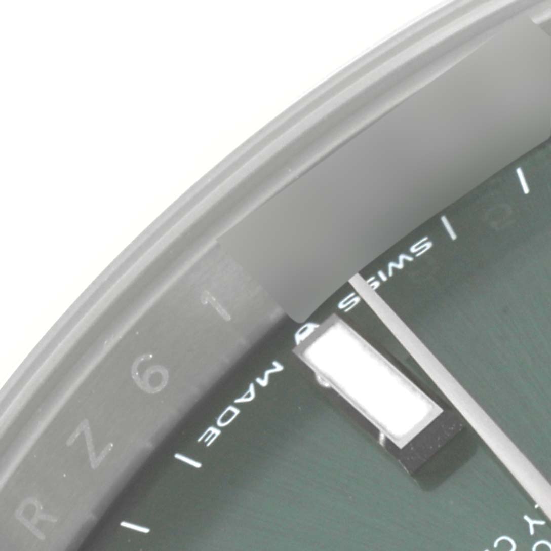 This image shows a close-up of the dial and bezel of a Rolex Datejust 41 126300 Men
s Stainless Steel Green Dial 126300 Men
s Stainless Steel Green Dial watch.