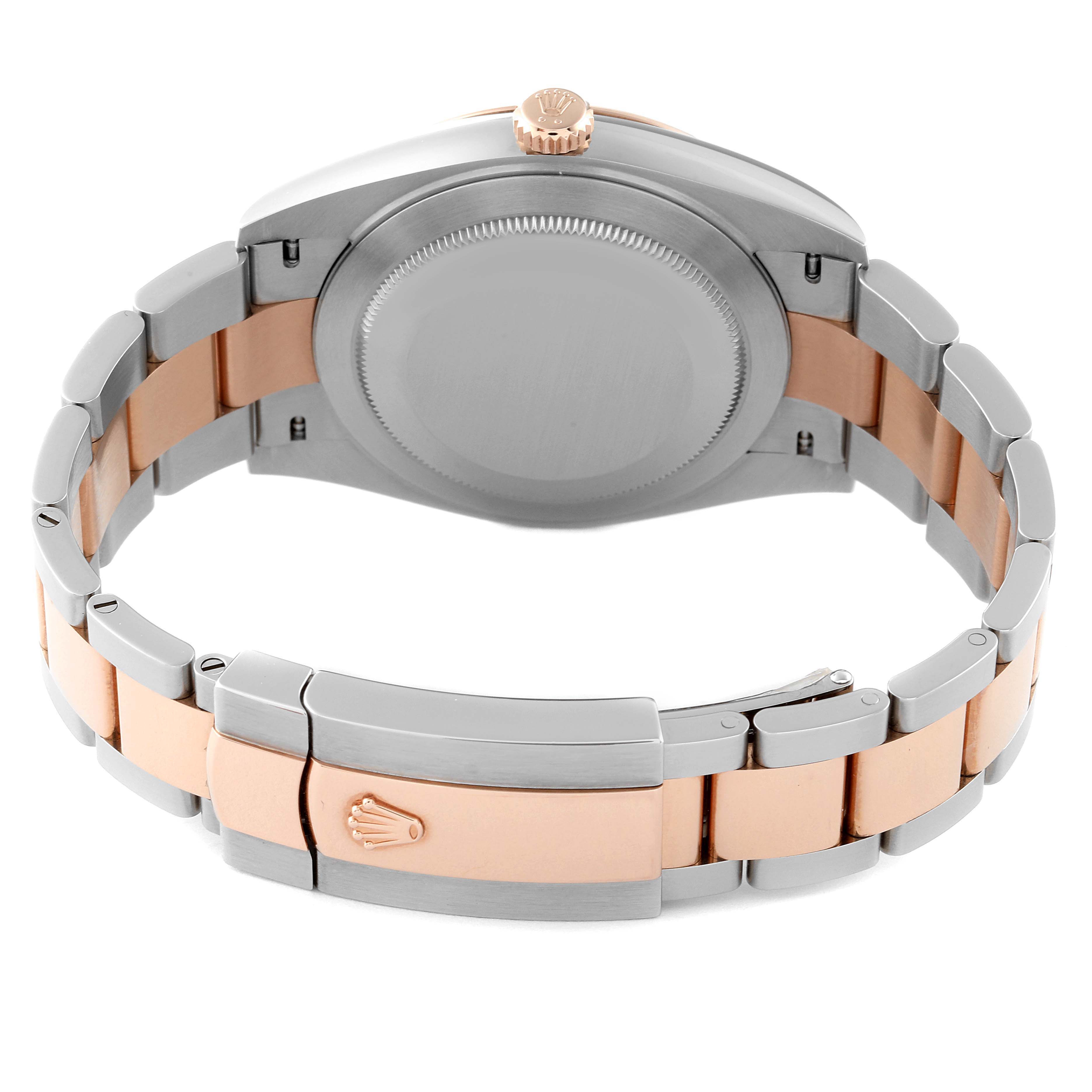 This image shows the back, the crown, and bracelet clasp of the Rolex Datejust 41 126331 Men's Steel and Gold (two tone) Brown Dial 126331 Men's Steel and Gold (two tone) Brown Dial watch.