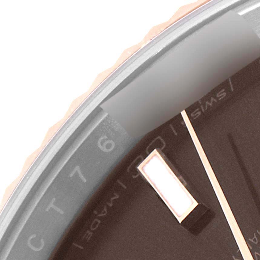 The image shows a close-up of the dial and bezel of a Rolex Datejust 41 126331 Men's Steel and Gold (two tone) Brown Dial 126331 Men's Steel and Gold (two tone) Brown Dial watch, highlighting an hour marker and part of the flange.