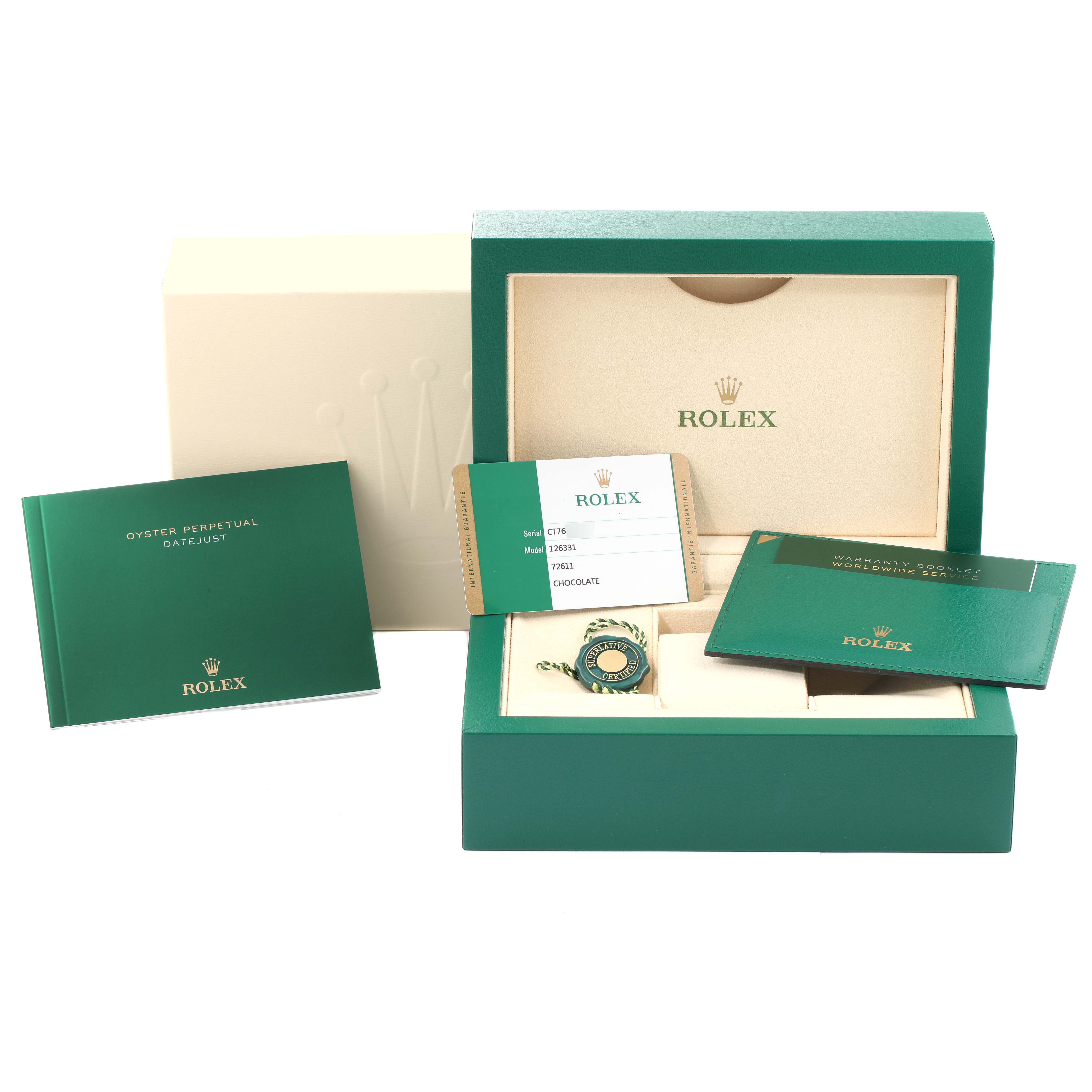 The image shows the packaging and accessories for the Rolex Datejust 41 126331 Men's Steel and Gold (two tone) Brown Dial 126331 Men's Steel and Gold (two tone) Brown Dial model, including booklets, a tag, and a warranty card.