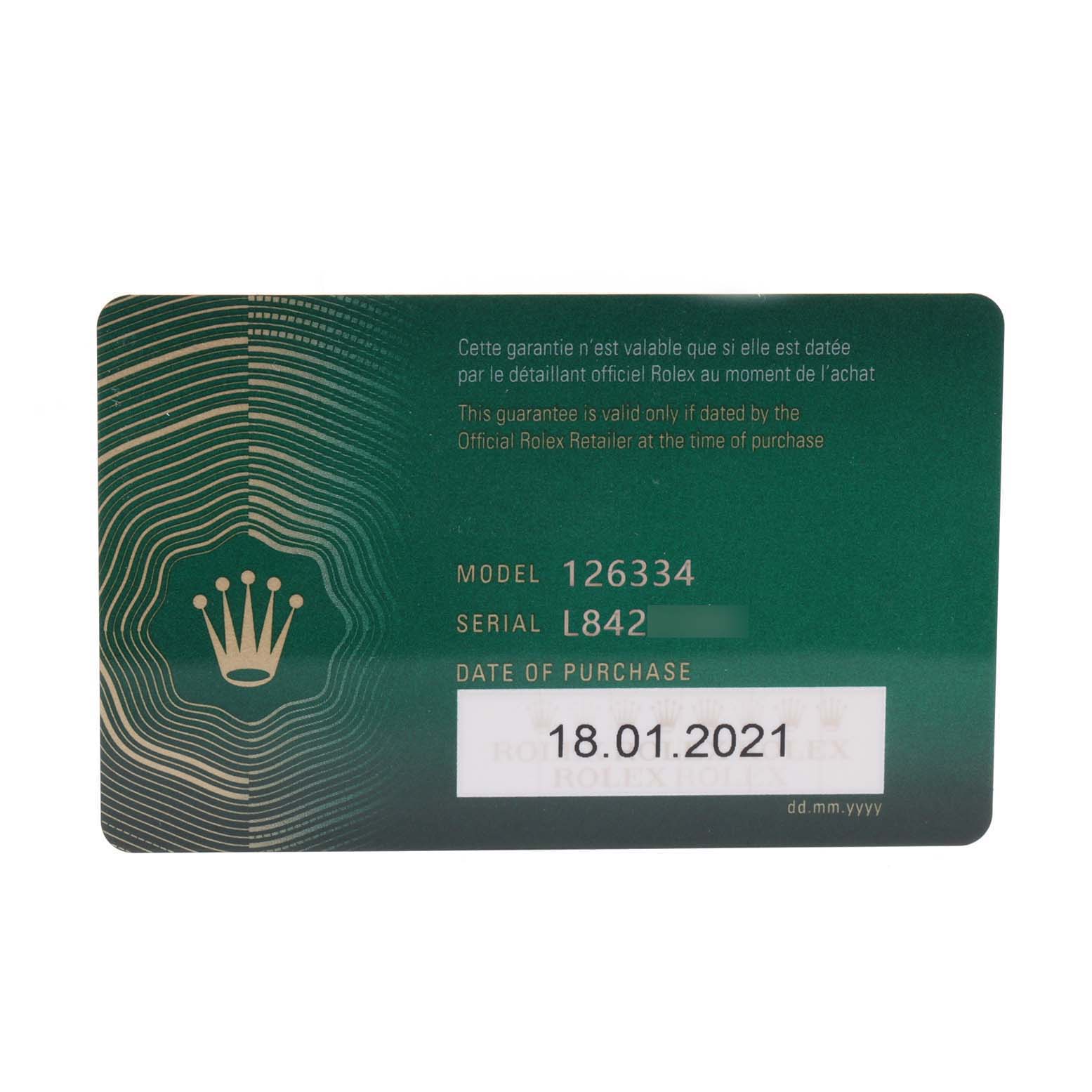 This image shows the guarantee card for a Rolex Datejust 126334 Men
s Stainless Steel Mother of Pearl Dial 126334 Men
s Stainless Steel Mother of Pearl Dial model 126334, featuring the model and serial numbers and purchase date.