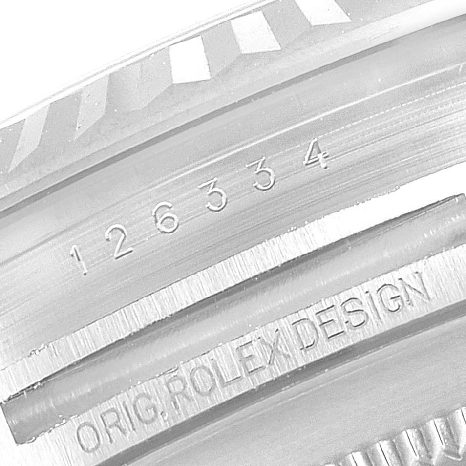 The image shows a close-up view of the serial and model numbers on the inner bezel of a Rolex Datejust 41 126334 Men
s Stainless Steel Silver Dial 126334 Men
s Stainless Steel Silver Dial.