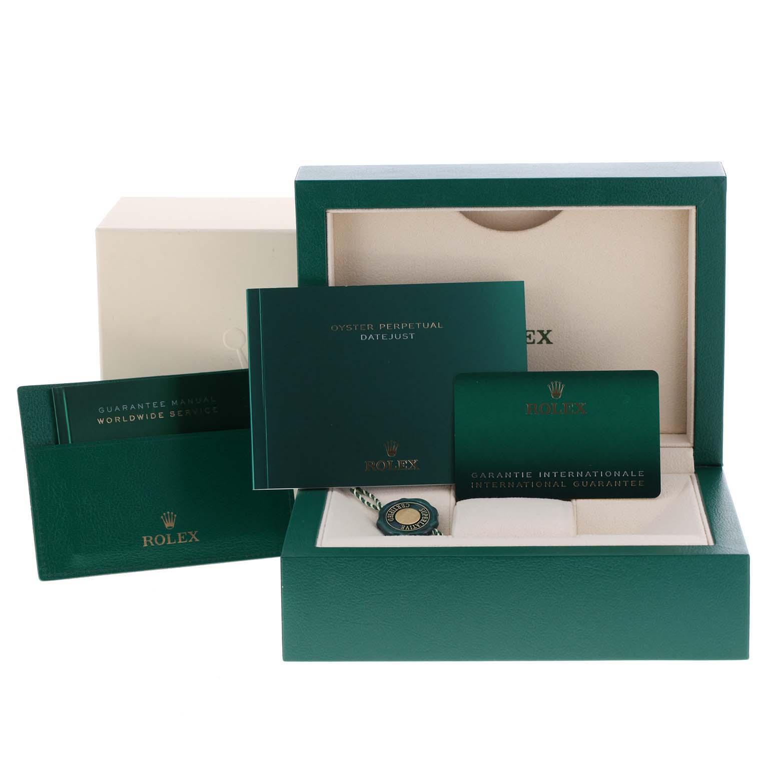 The image shows the accessories for a Rolex Datejust 41 126334 Men
s Stainless Steel White Dial 126334 Men
s Stainless Steel White Dial watch, including a box, manuals, tags, and warranty card.