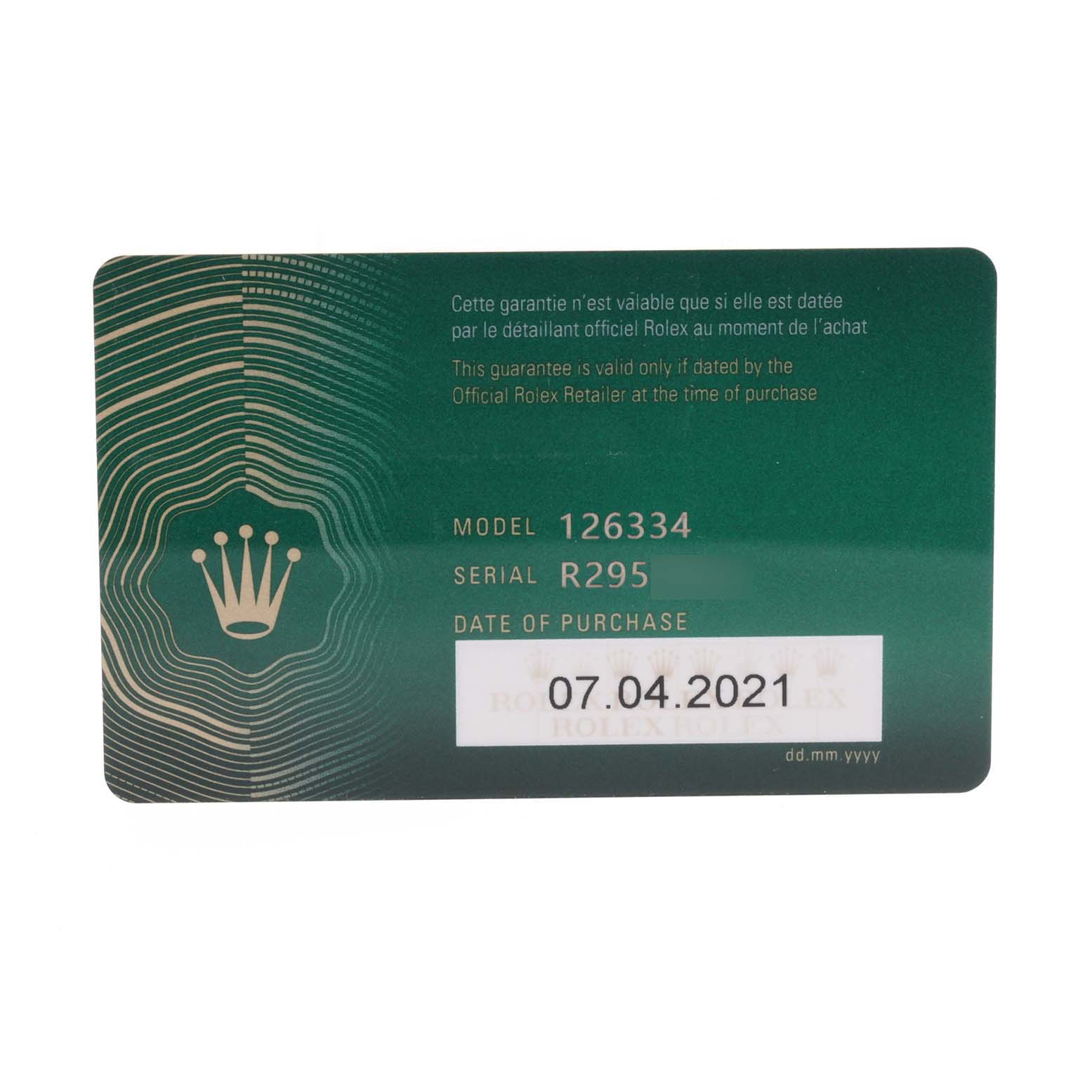 The image shows a green warranty card for the Rolex Datejust 41 126334 Men
s Stainless Steel White Dial 126334 Men
s Stainless Steel White Dial model 126334.