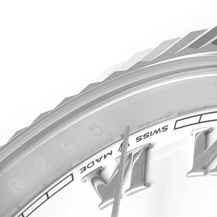 This close-up image of the Rolex Datejust 41 126334 Men
s Stainless Steel White Dial 126334 Men
s Stainless Steel White Dial shows part of the watch face, specifically the Roman numerals, minute markings, and part of the bezel.