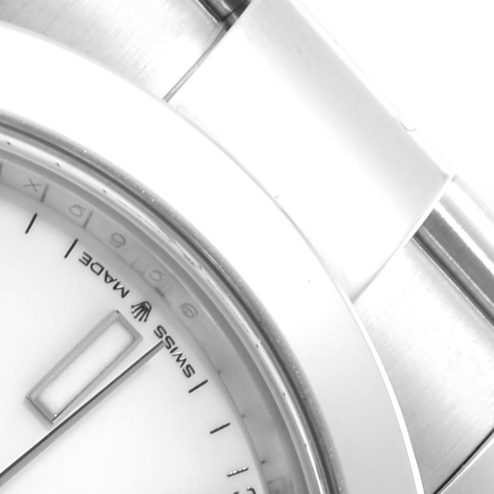 This close-up image of the Rolex Datejust 41 126300 Men's Stainless Steel White Dial 126300 Men's Stainless Steel White Dial watch shows part of the dial, bezel, and bracelet.