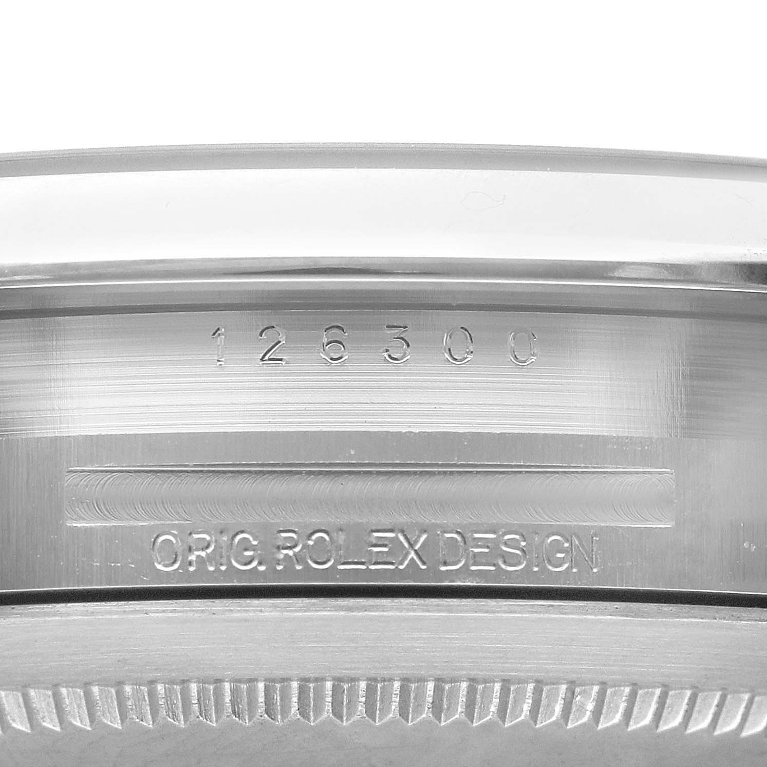 The image shows a close-up of the side of a Rolex Datejust 41 126300 Men's Stainless Steel White Dial 126300 Men's Stainless Steel White Dial watch, highlighting the model number and "ORIG. ROLEX DESIGN" engraving.