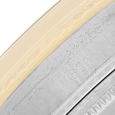 The image shows a close-up of the side of the bezel and a portion of the case of the Rolex Vintage Collection 1601 Men
s Steel and Gold (two tone) Champagne Dial 1601 Men
s Steel and Gold (two tone) Champagne Dial watch.