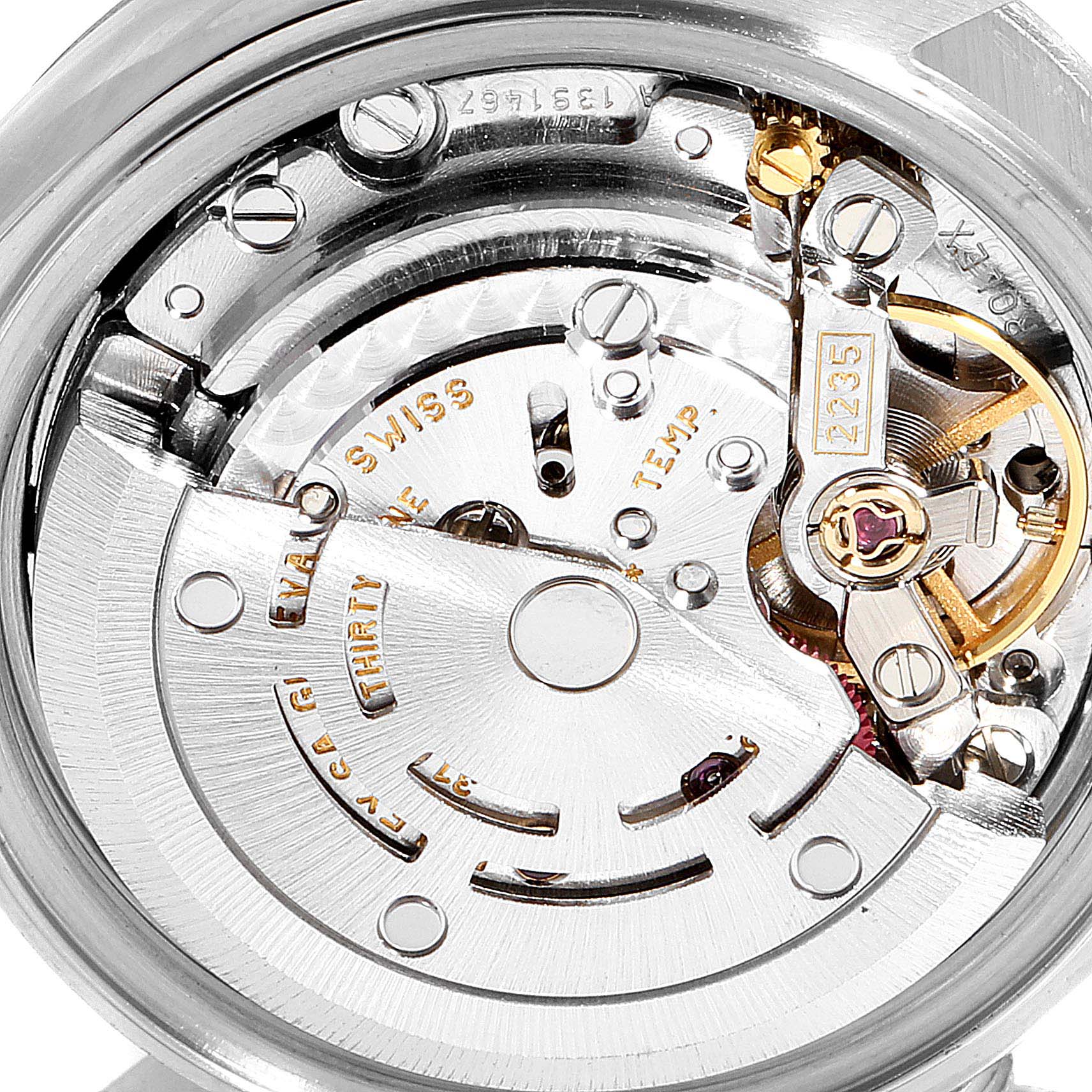 The image displays the internal movement mechanism of a Rolex Datejust 79174 Women
s Stainless Steel Mother of Pearl Dial 79174 Women
s Stainless Steel Mother of Pearl Dial watch from a close-up angle.