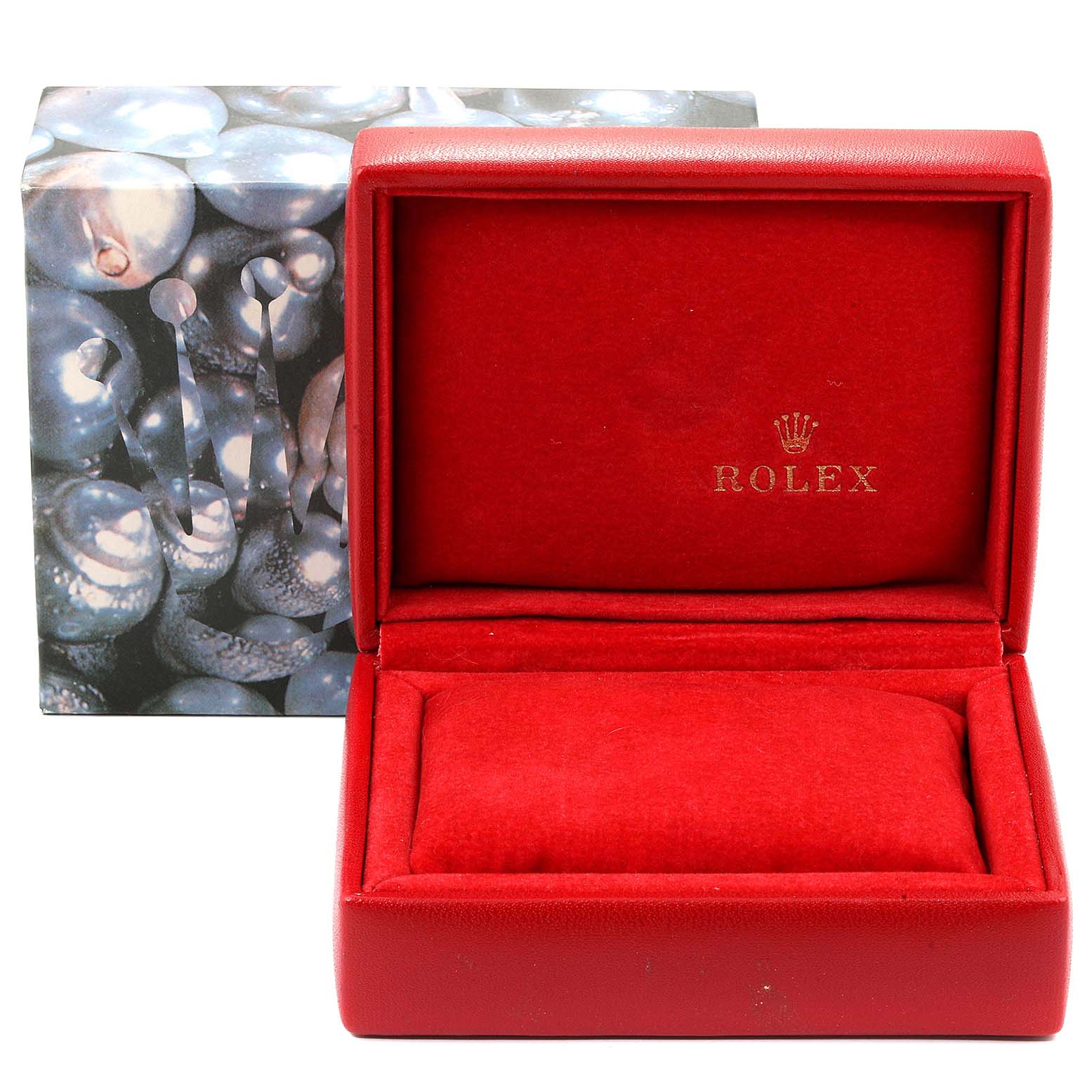 The image shows an empty red Rolex watch box for the Datejust model.