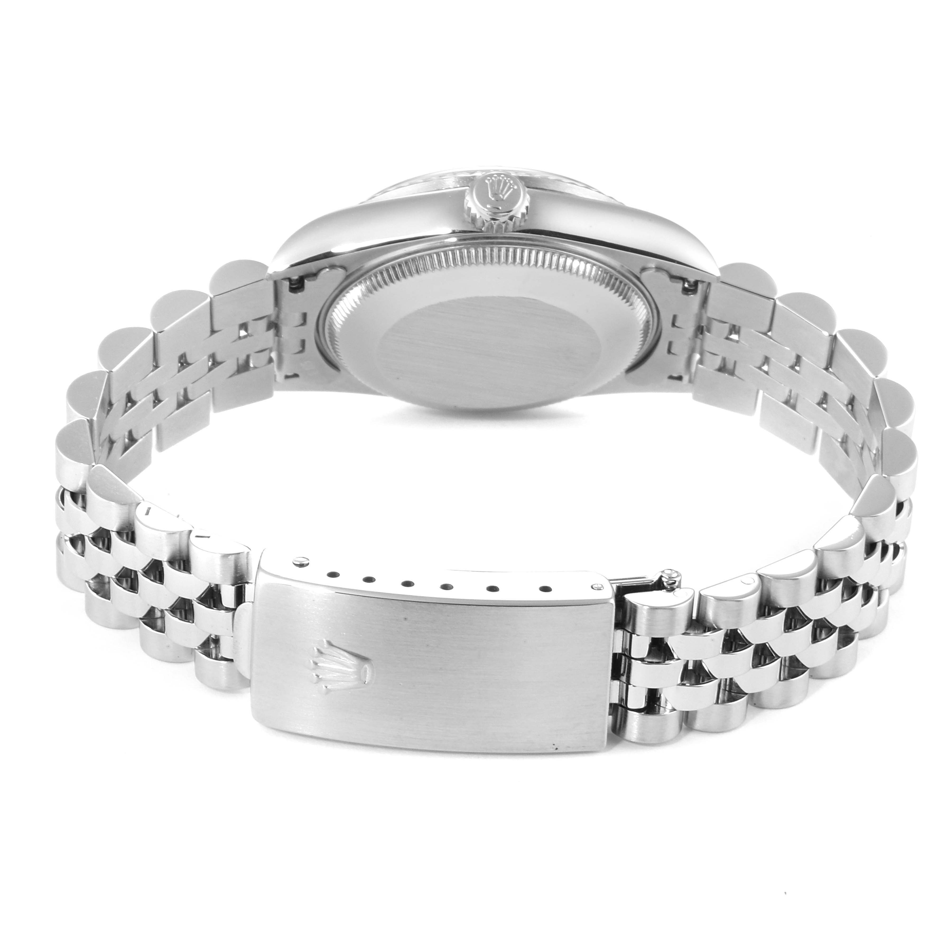 The image shows the back view of the Mid-Size Rolex watch, displaying the case back, crown, and bracelet clasp.