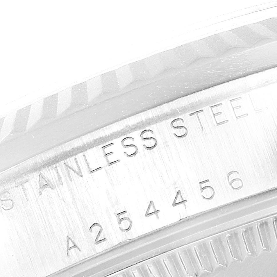 The image shows a close-up of the case back, with "STAINLESS STEEL" and serial number of a Rolex Mid-Size 78274 Women
s Stainless Steel Black Dial 78274 Women
s Stainless Steel Black Dial model.