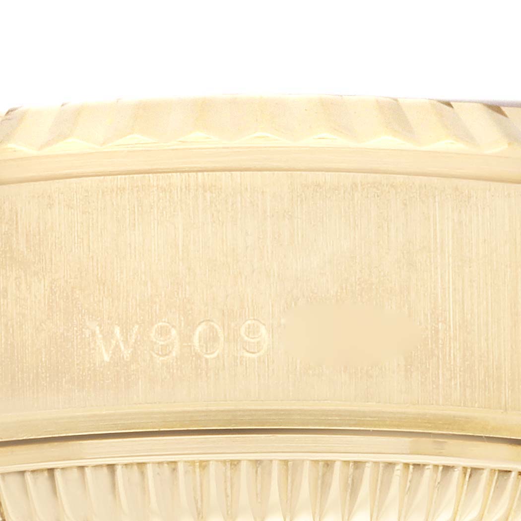 This close-up image shows the side of the case and the edge of the fluted bezel of a Rolex President 69178 Women's Yellow Gold Champagne Dial 69178 Women's Yellow Gold Champagne Dial model watch.