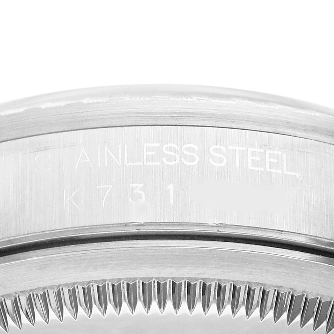 This image shows a close-up view of the stainless steel caseback and the edge of the bezel of a Rolex Datejust 16220 Men's Stainless Steel Silver Dial 16220 Men's Stainless Steel Silver Dial watch.