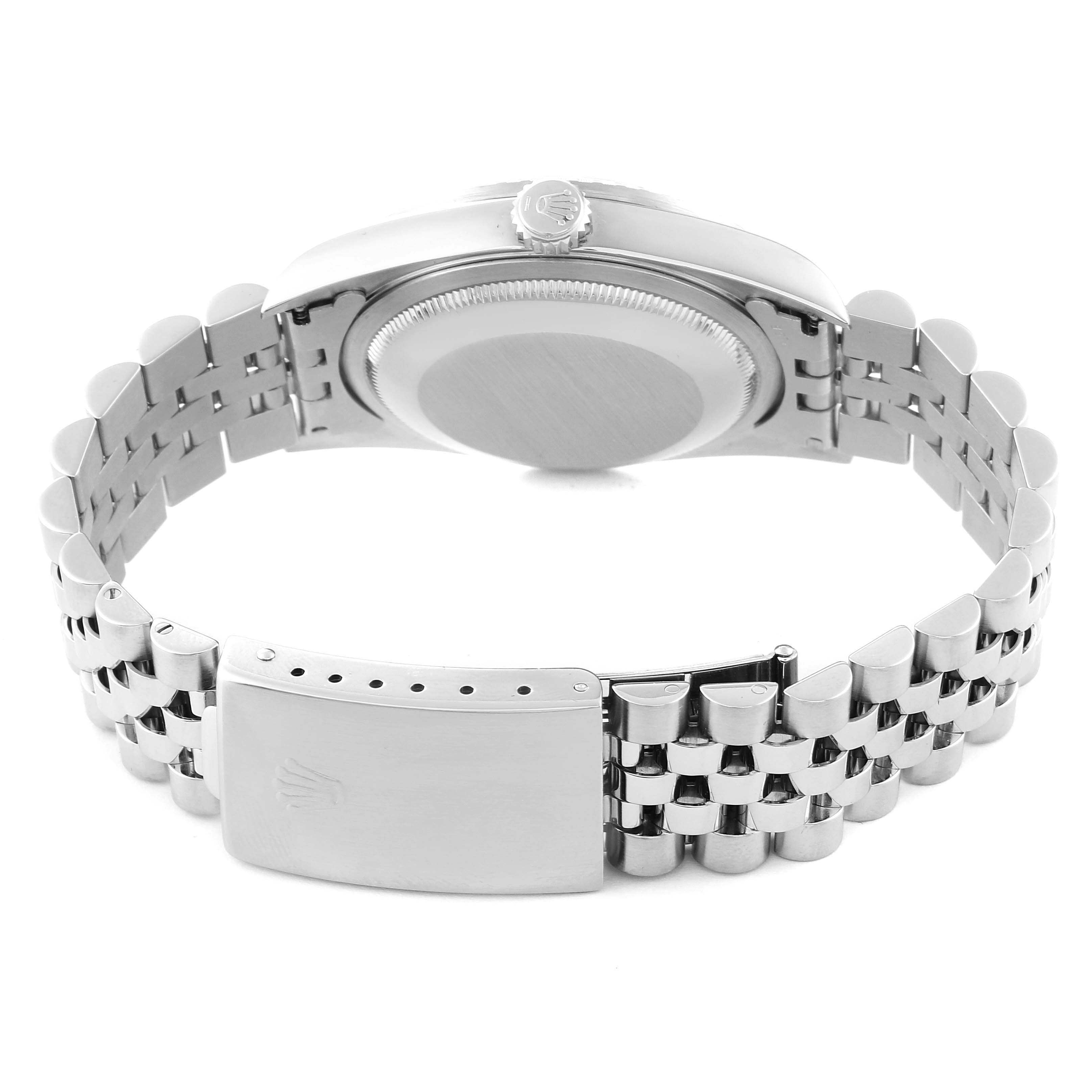 The image shows a rear angle of a Rolex Datejust 16220 Men's Stainless Steel Silver Dial 16220 Men's Stainless Steel Silver Dial watch, highlighting the case back and the Jubilee bracelet with a clasp.