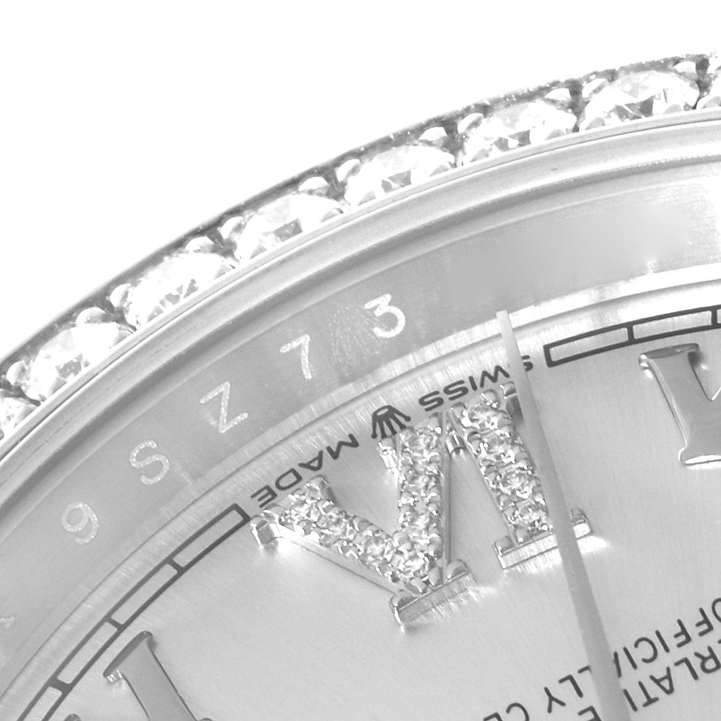 This close-up image shows the bezel, part of the dial, and the Roman numeral VI on a Rolex Datejust 126284 Men's Stainless Steel Silver Dial 126284 Men's Stainless Steel Silver Dial watch with diamond accents.