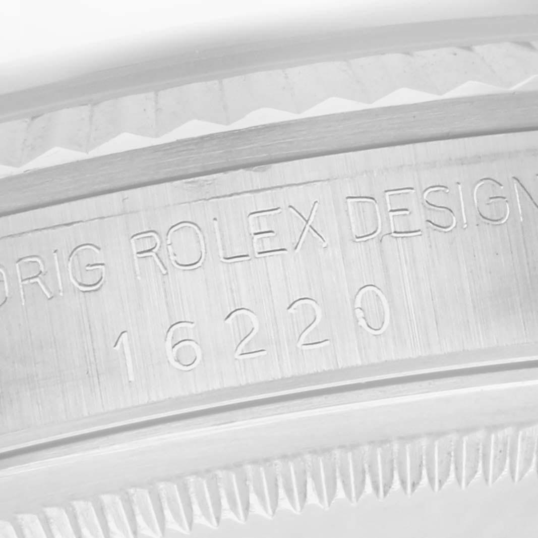 The image shows a close-up of the inner bezel or rehaut with the engraving "ORIG ROLEX DESIGN 16220" on the Rolex Datejust 16220 Men
s Stainless Steel Silver Dial 16220 Men
s Stainless Steel Silver Dial.