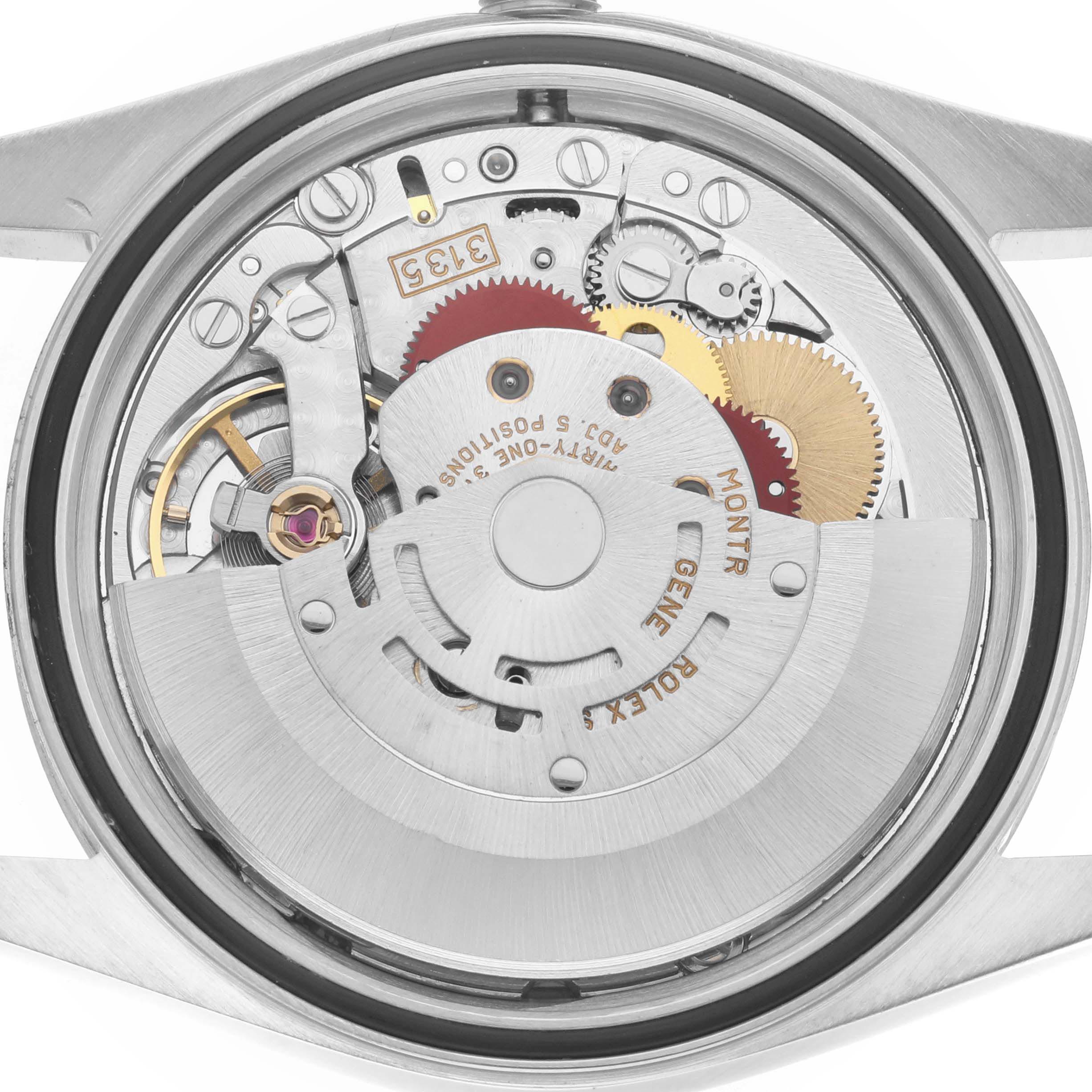 The image shows a close-up view of the Rolex Datejust 16220 Men
s Stainless Steel Silver Dial 16220 Men
s Stainless Steel Silver Dial watch movement from the back, displaying its intricate mechanics.