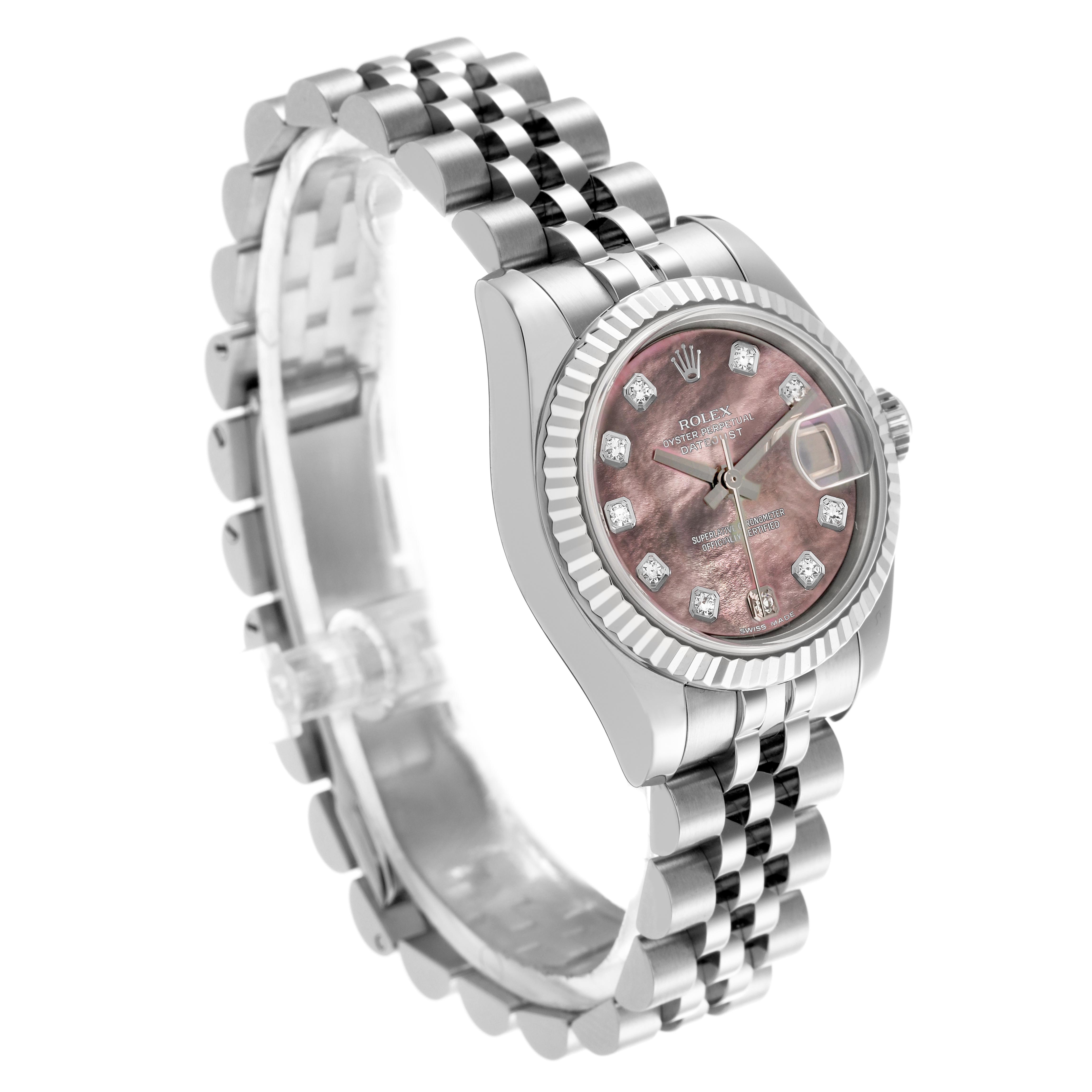 The Rolex Datejust 179174 Women
s Stainless Steel Mother of Pearl Dial 179174 Women
s Stainless Steel Mother of Pearl Dial watch is shown at an angle highlighting the fluted bezel, dial with diamond markers, and Jubilee bracelet.