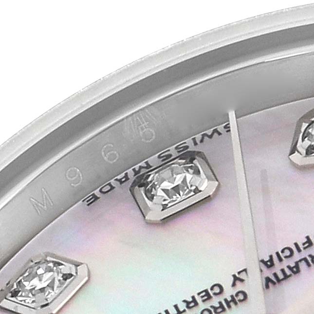 The image shows a close-up of the dial of a Rolex Datejust 179174 Women
s Stainless Steel Mother of Pearl Dial 179174 Women
s Stainless Steel Mother of Pearl Dial, highlighting diamond hour markers and a portion of the watch
s edge.