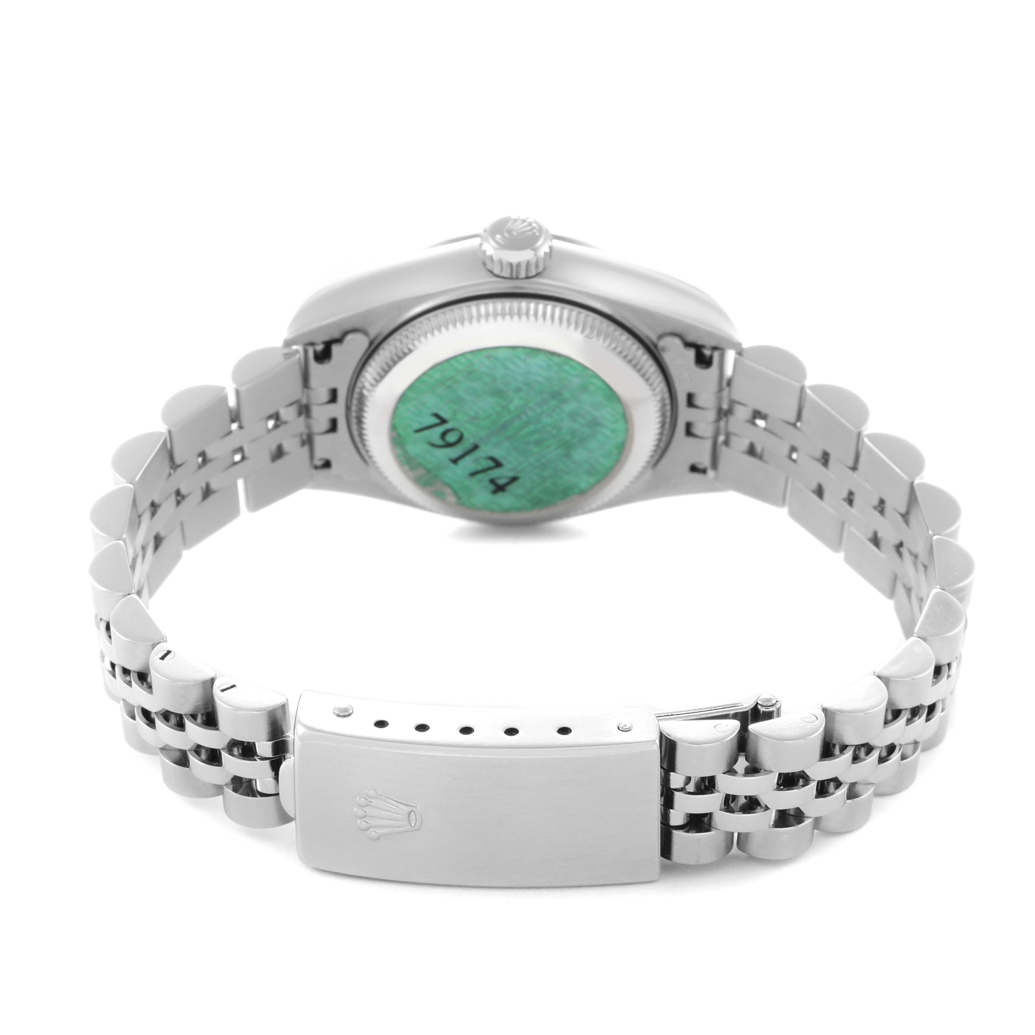 The Rolex Datejust 79174 Women
s Stainless Steel White Dial 79174 Women
s Stainless Steel White Dial is shown from the back, highlighting the case back, crown, and bracelet with the clasp open.