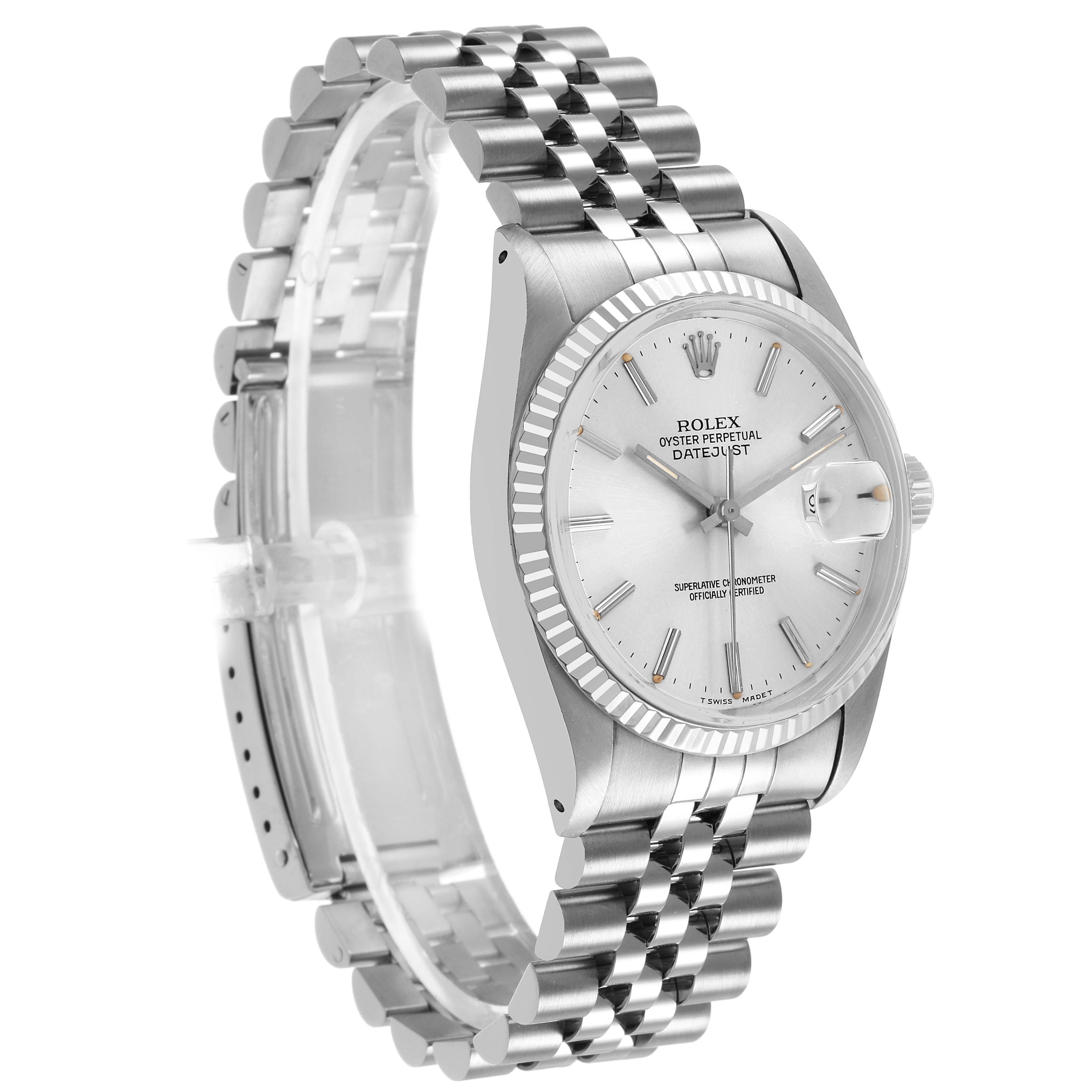 The Rolex Datejust 16014 Men's Stainless Steel Silver Dial watch is shown at a three-quarter angle, highlighting the dial, bezel, and bracelet.