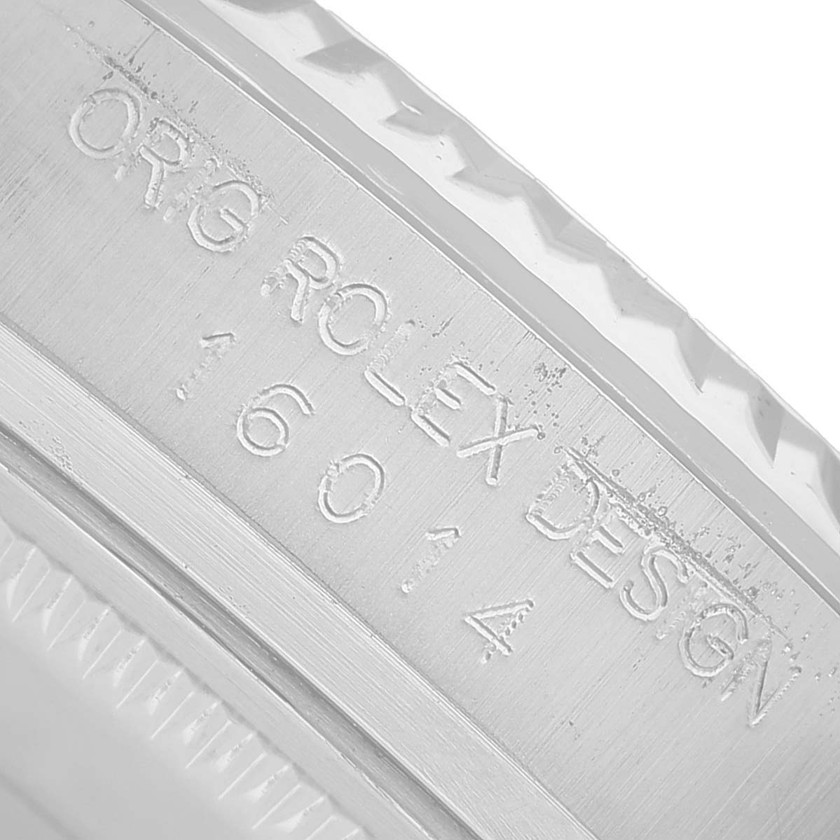 The image shows the engraving inside the case of a Rolex Datejust 16014 Men's Stainless Steel Silver Dial, displaying the model and design numbers.