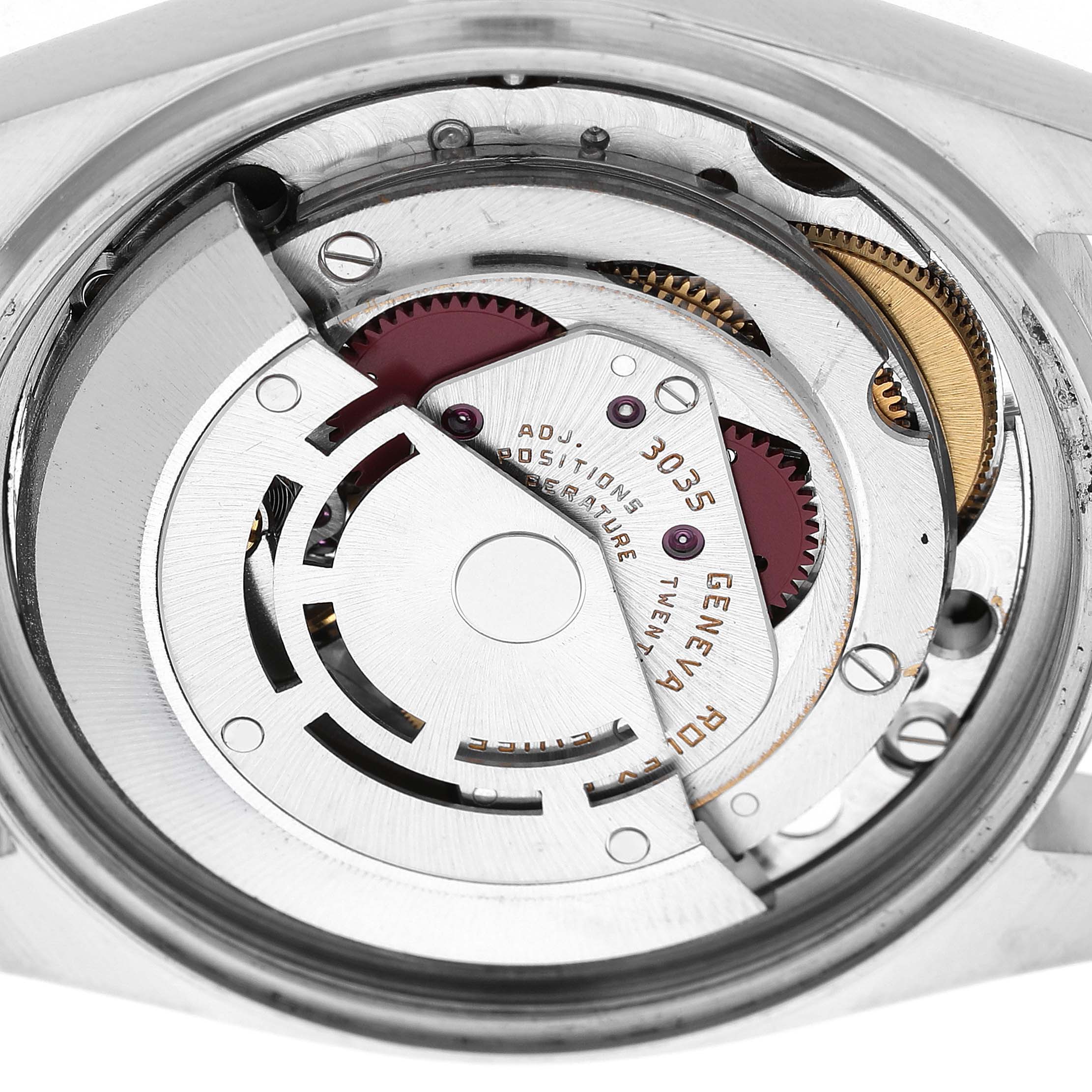 The image shows a close-up view of the Rolex Datejust 16014 Men's Stainless Steel Silver Dial movement, highlighting its detailed internal mechanics.