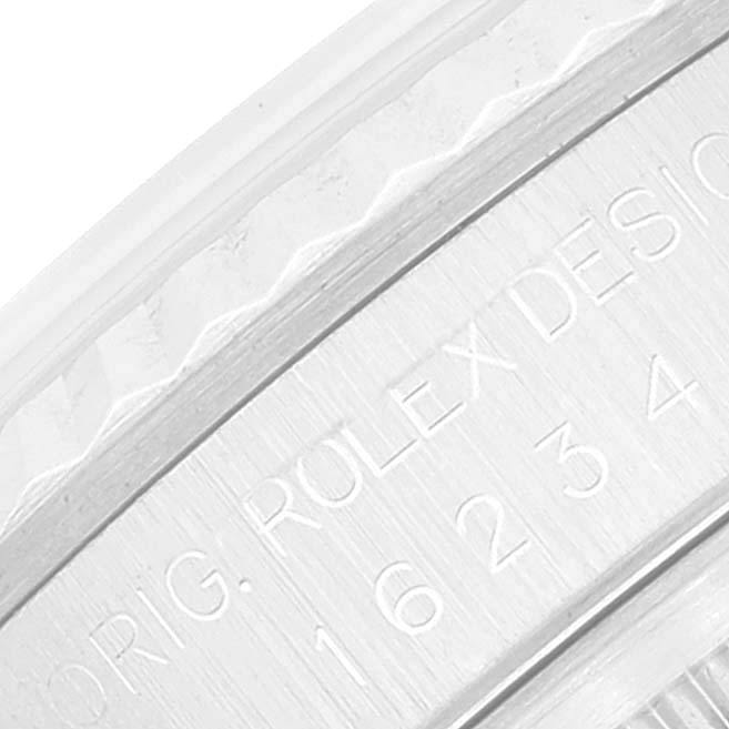 This close-up image shows the engraved inner bezel of a Rolex Datejust 16234 Men's Stainless Steel Silver Dial 16234 Men's Stainless Steel Silver Dial, featuring the model number and design details.