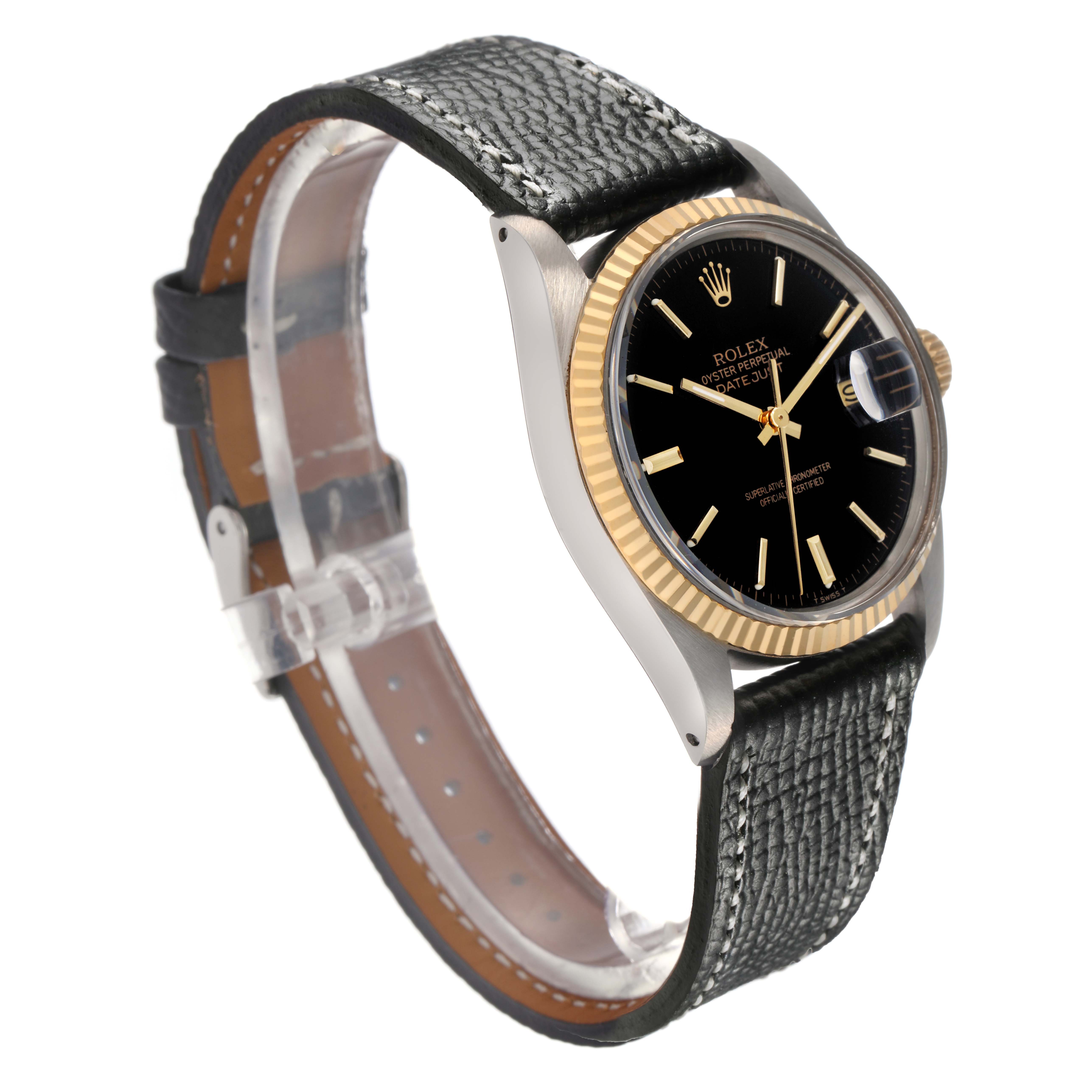 The Rolex Datejust 16013 Men
s Steel and Gold (two tone) Black Dial 16013 Men
s Steel and Gold (two tone) Black Dial watch is shown from a front-side angle, displaying its black dial, gold fluted bezel, and black strap.