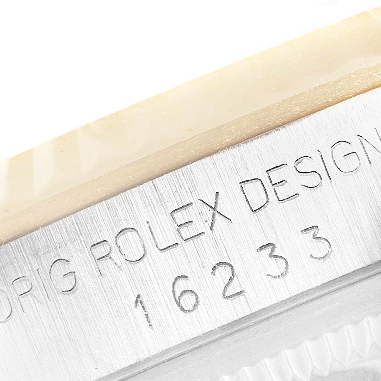 This close-up image shows the model number "16233" engraved on the side of the Rolex Datejust 16233 Men's Steel and Gold (two tone) Champagne Dial 16233 Men's Steel and Gold (two tone) Champagne Dial watch case.