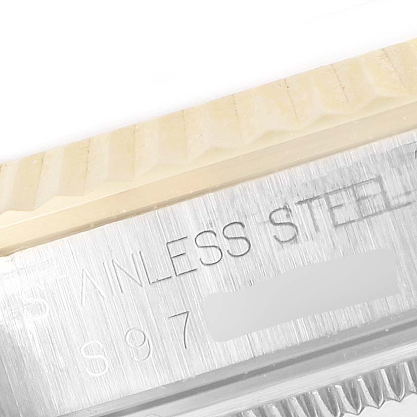 This image shows a close-up of the bezel and stainless steel engraving on a Rolex Datejust 16233 Men's Steel and Gold (two tone) Champagne Dial 16233 Men's Steel and Gold (two tone) Champagne Dial watch.