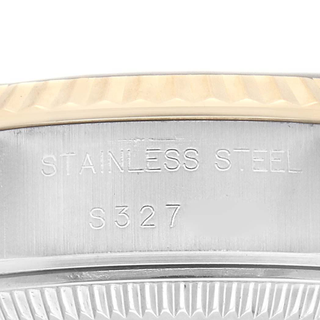 The image shows a close-up of the side and bezel of a Rolex Datejust 69173 Women's Steel and Gold (two tone) Black Dial 69173 Women's Steel and Gold (two tone) Black Dial watch with "STAINLESS STEEL" inscribed.