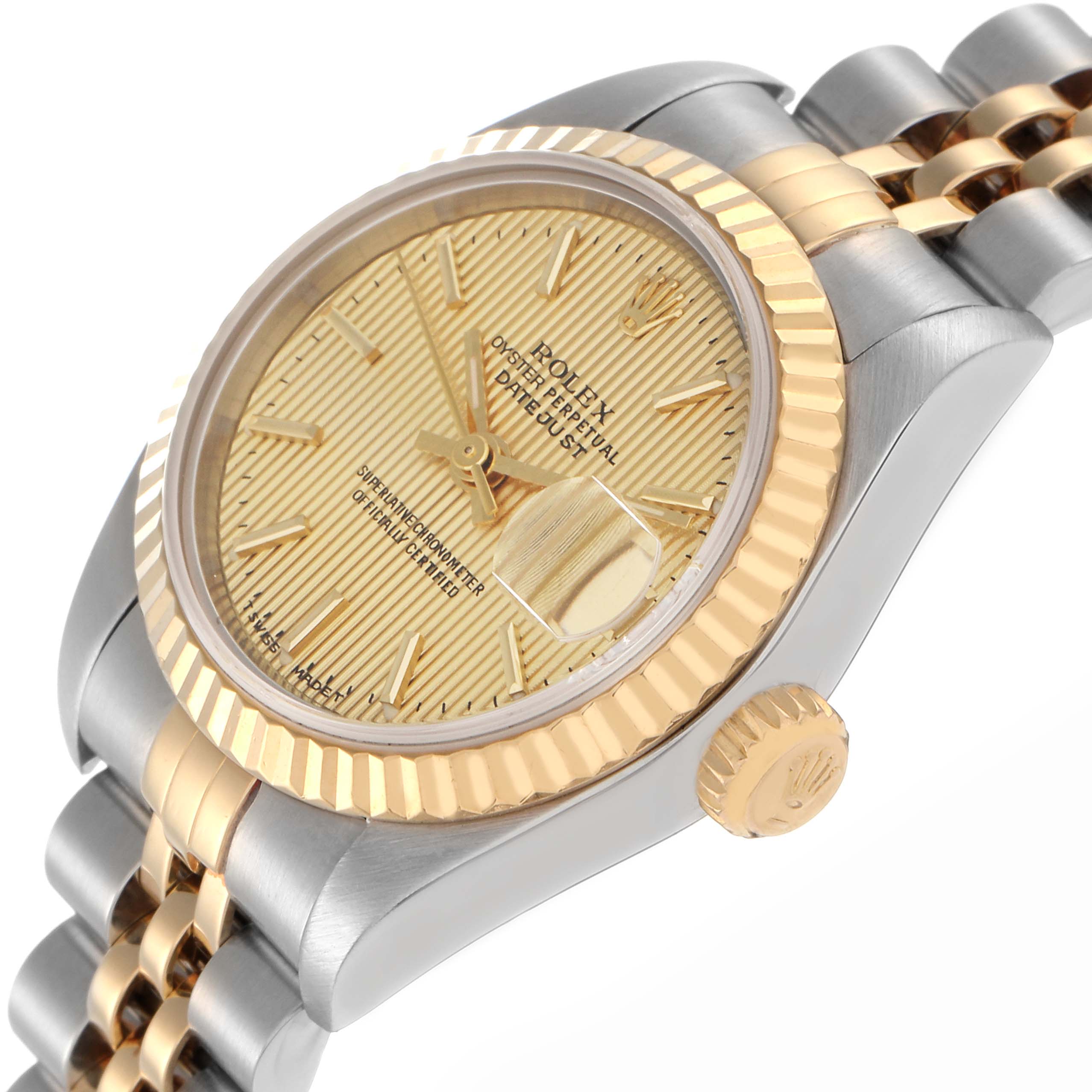 The Rolex Datejust 79173 Women
s Steel and Gold (two tone) Champagne Dial 79173 Women
s Steel and Gold (two tone) Champagne Dial is shown from an angled side view highlighting the dial, fluted bezel, crown, and two-tone bracelet.
